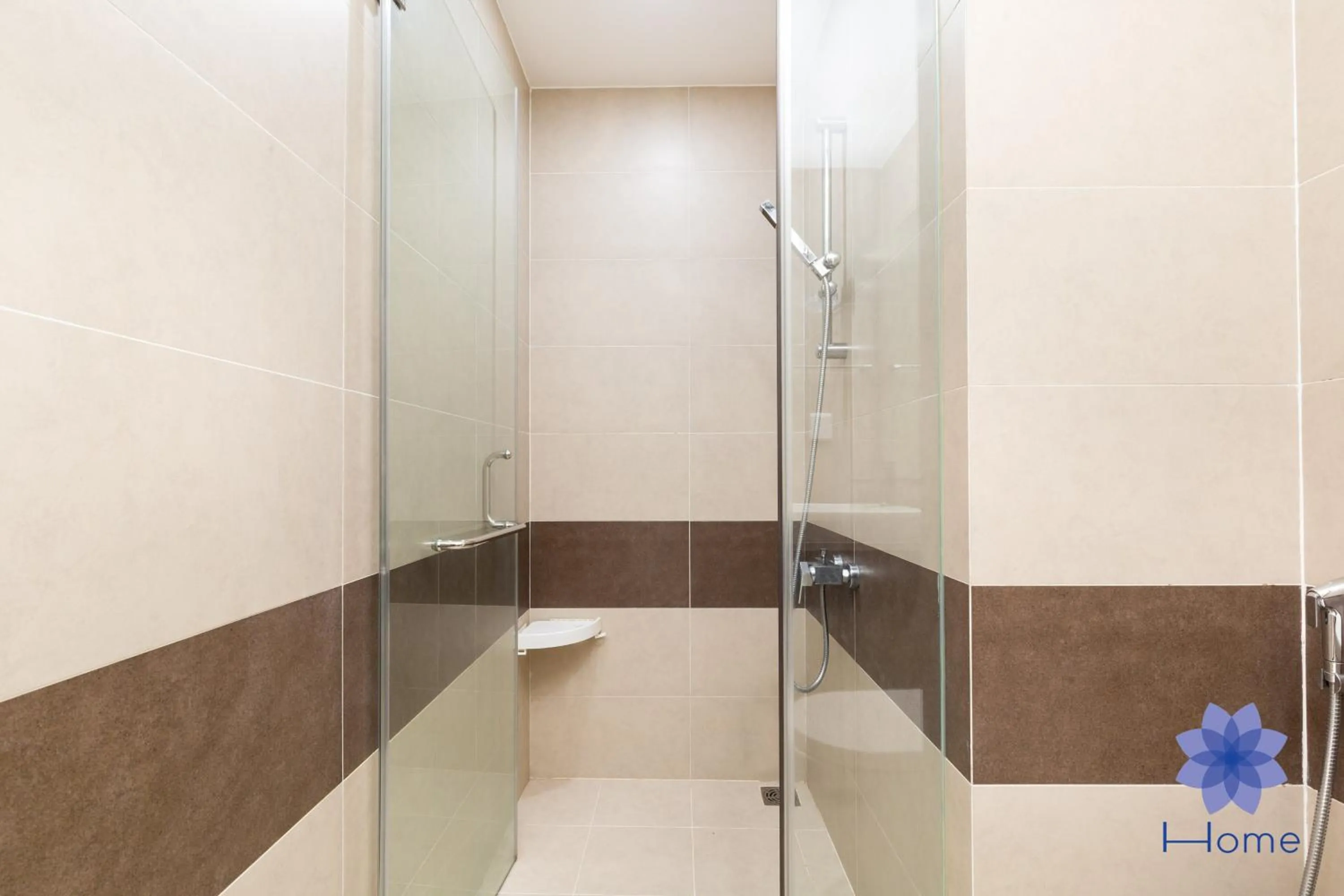 Shower in iHome Furnished Apartments with Free Gym & Pool, Airport Pick-Up Service