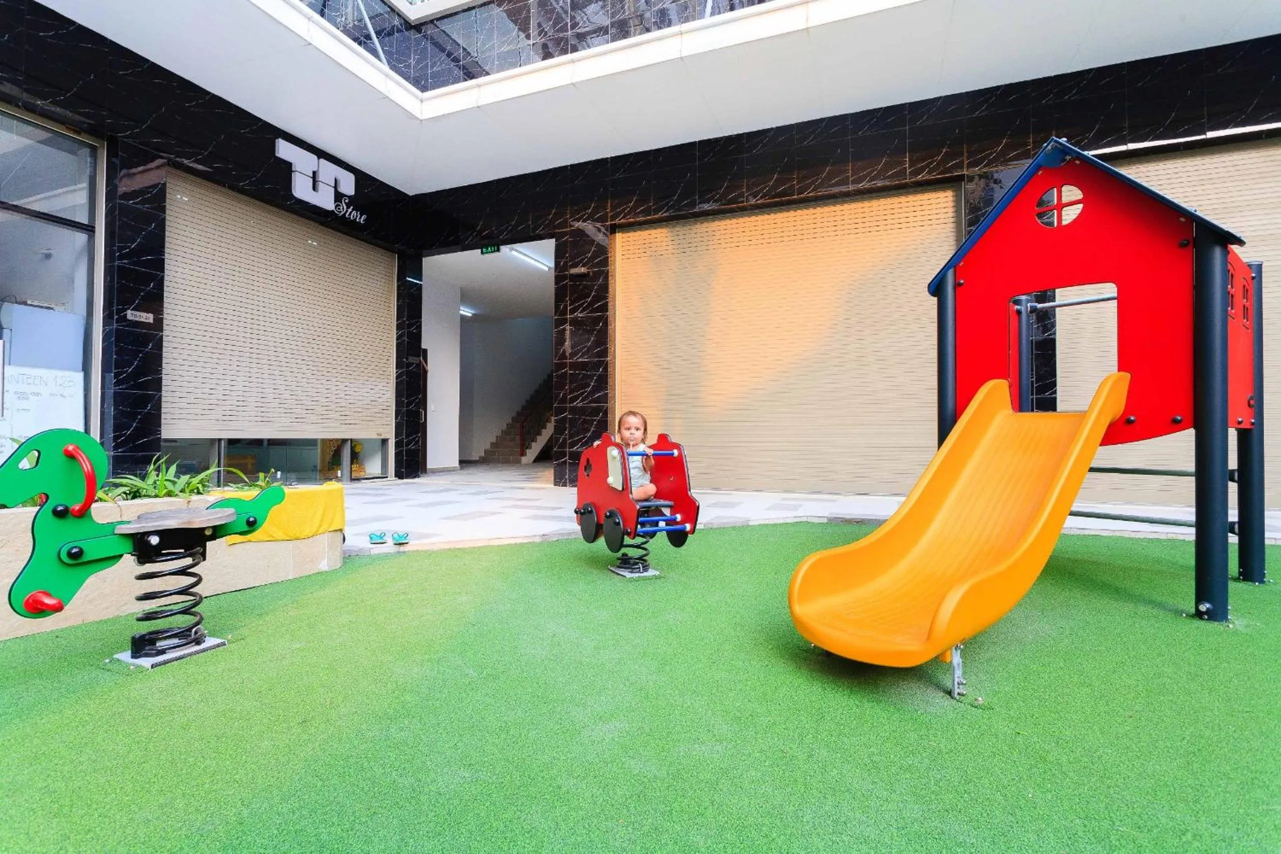 Children play ground in iHome Furnished Apartments with Free Gym & Pool, Airport Pick-Up Service