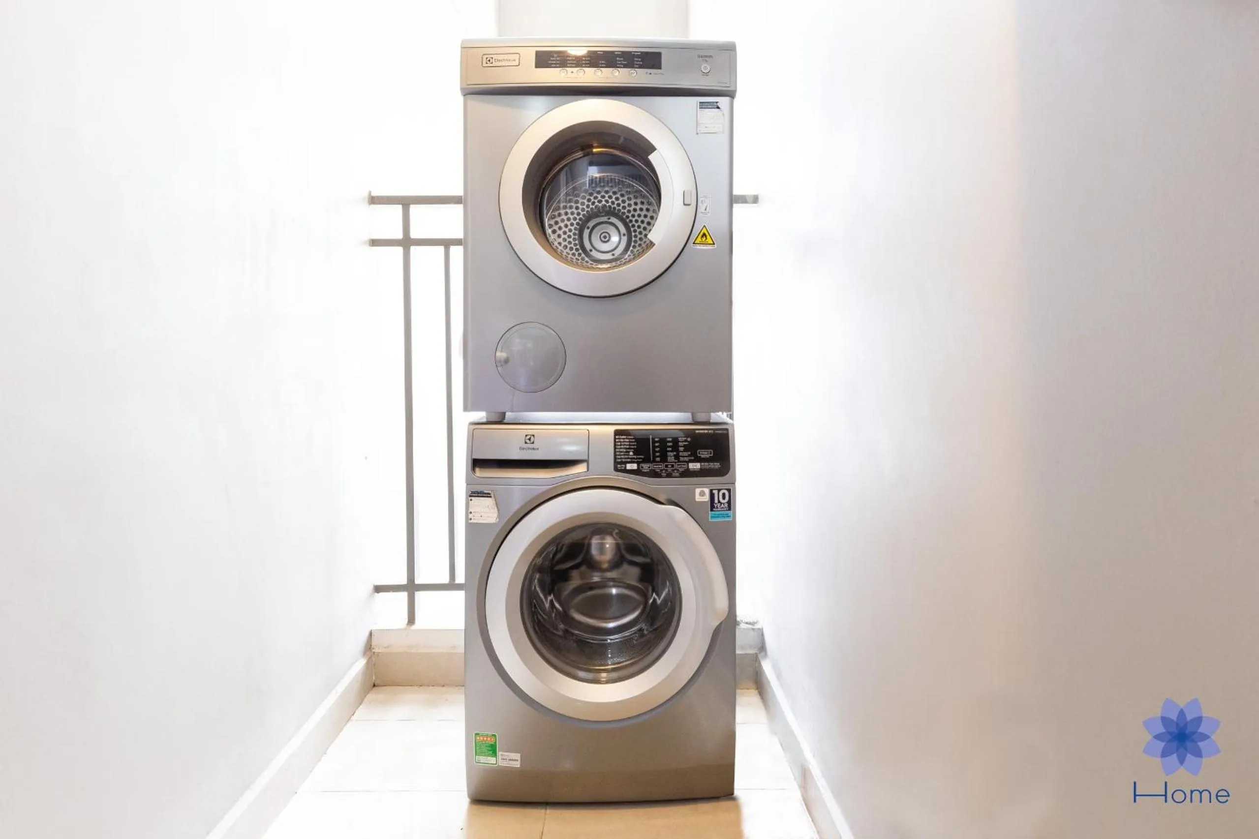 washing machine in iHome Furnished Apartments with Free Gym & Pool, Airport Pick-Up Service