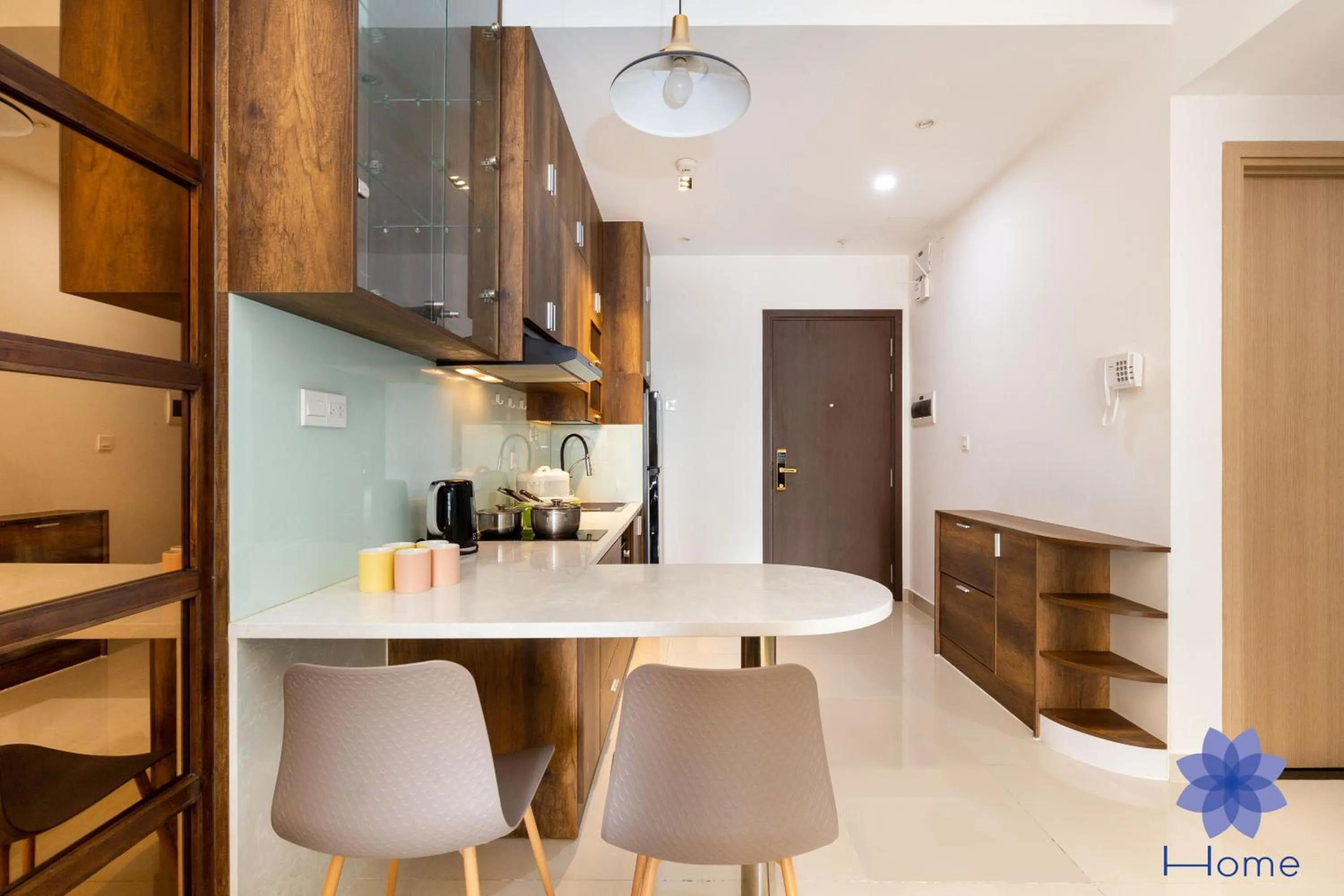 stove in iHome Furnished Apartments with Free Gym & Pool, Airport Pick-Up Service