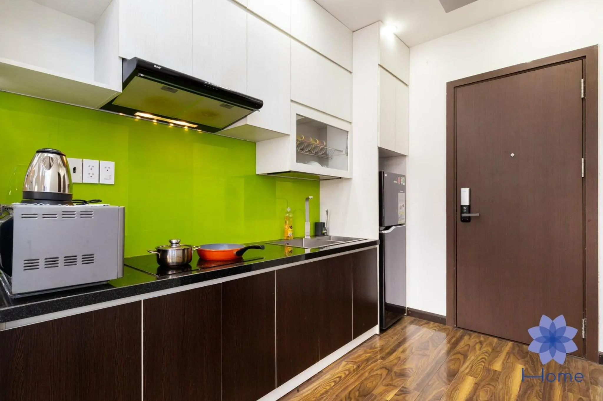 kitchen in iHome Furnished Apartments with Free Gym & Pool, Airport Pick-Up Service