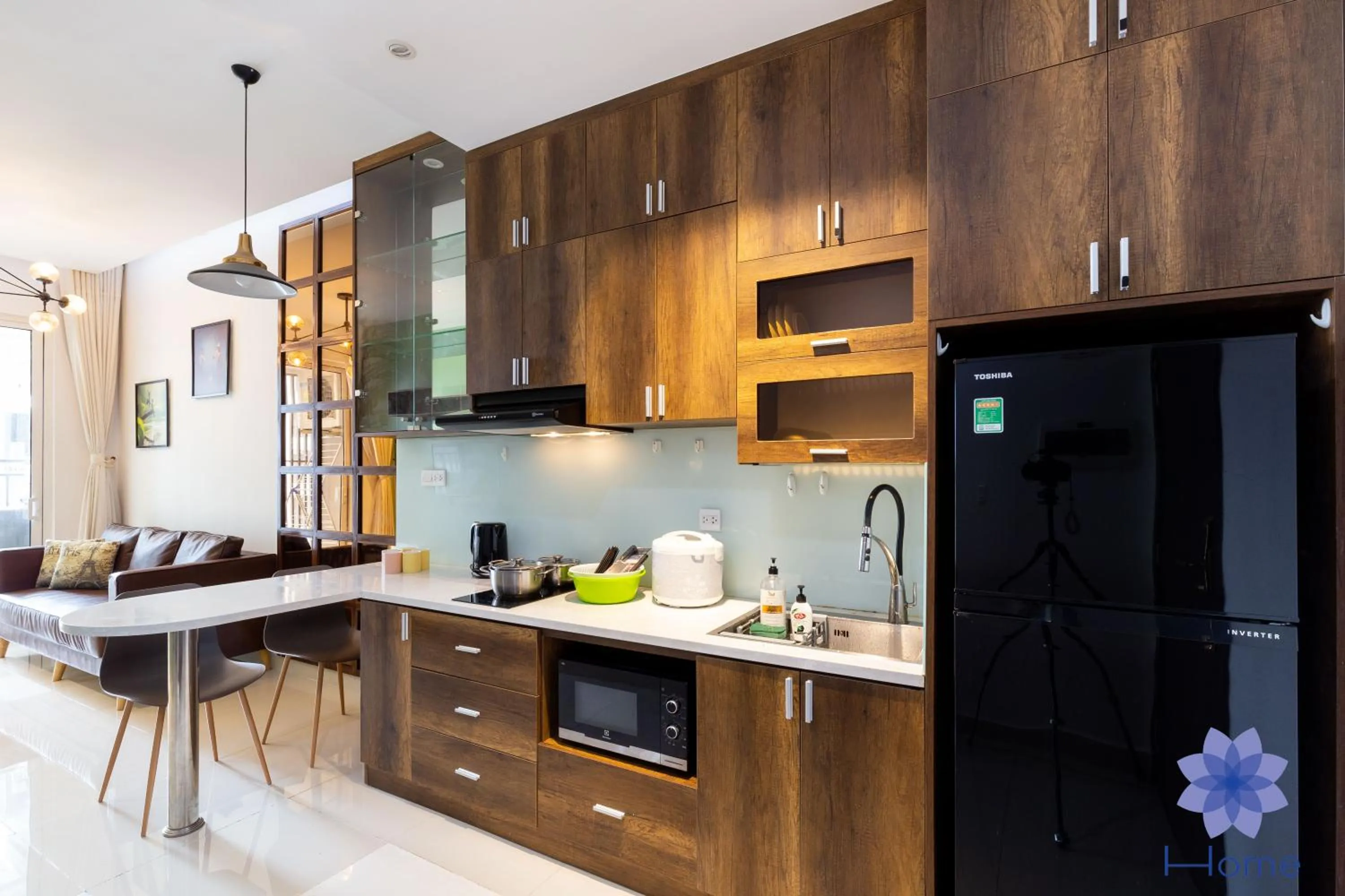 stove in iHome Furnished Apartments with Free Gym & Pool, Airport Pick-Up Service