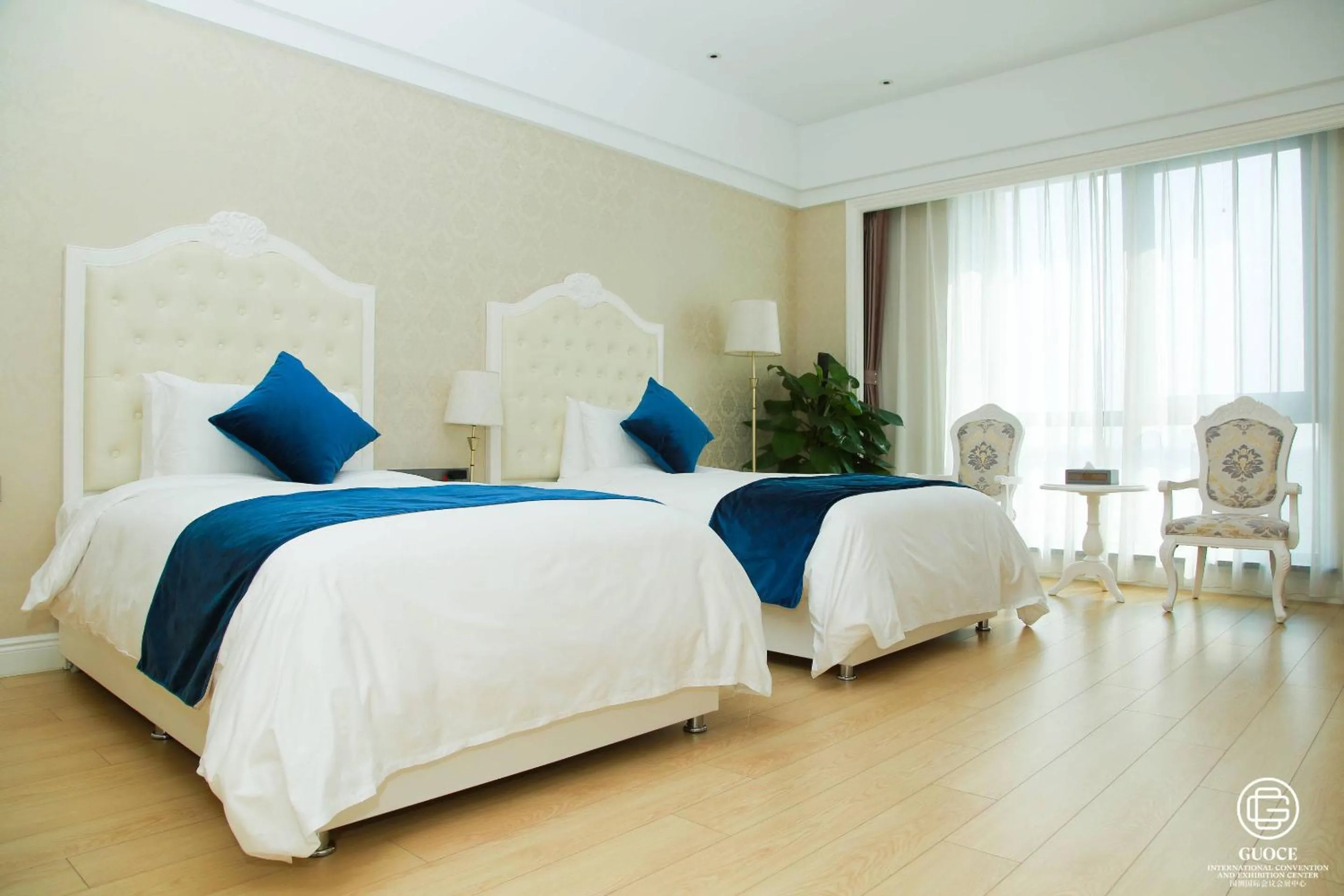 Bed in GUOCE Beijing Capital Airport Hotel & Convention Center