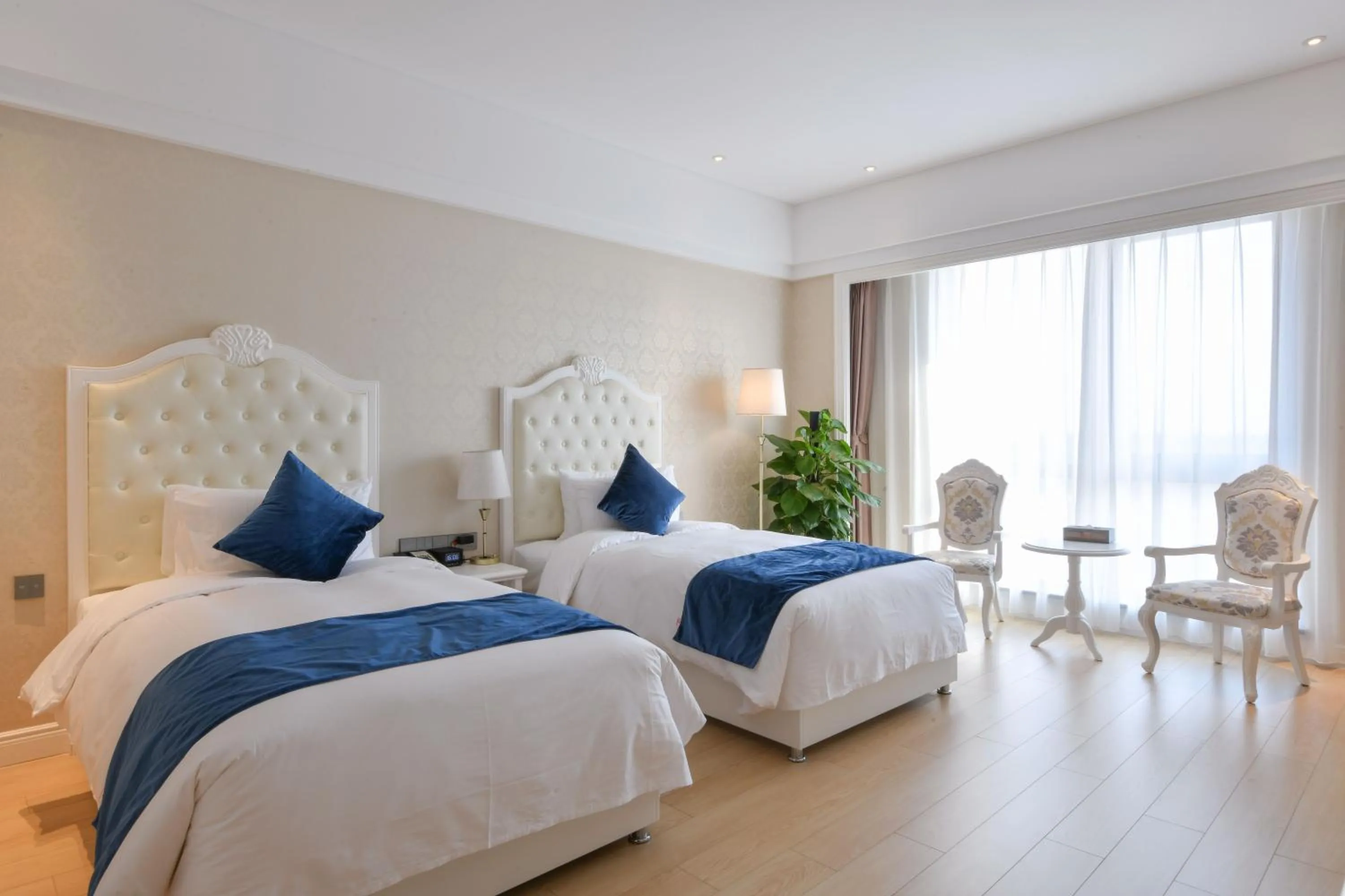 Bed in GUOCE Beijing Capital Airport Hotel & Convention Center