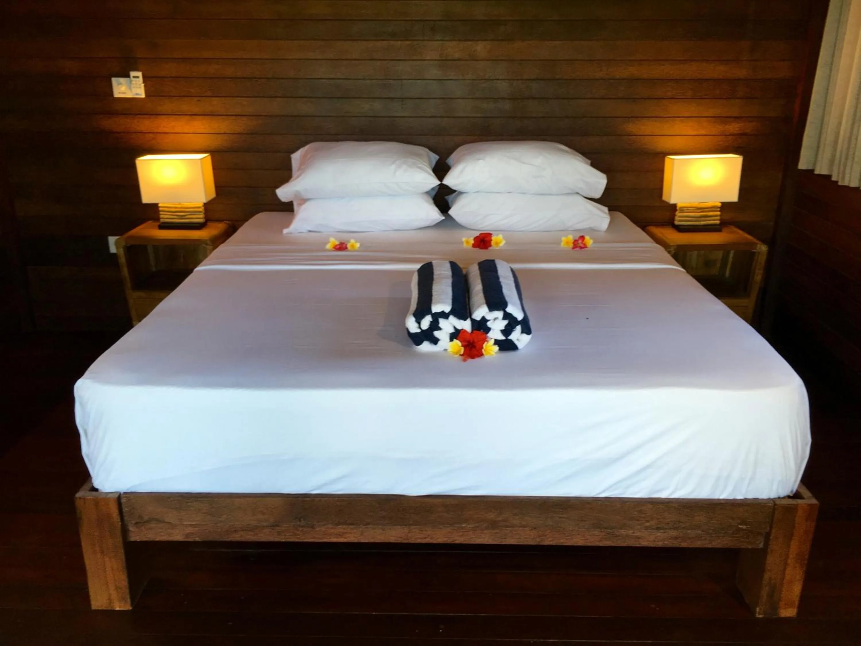 Bed in Twin Island Villas & Dive Resort