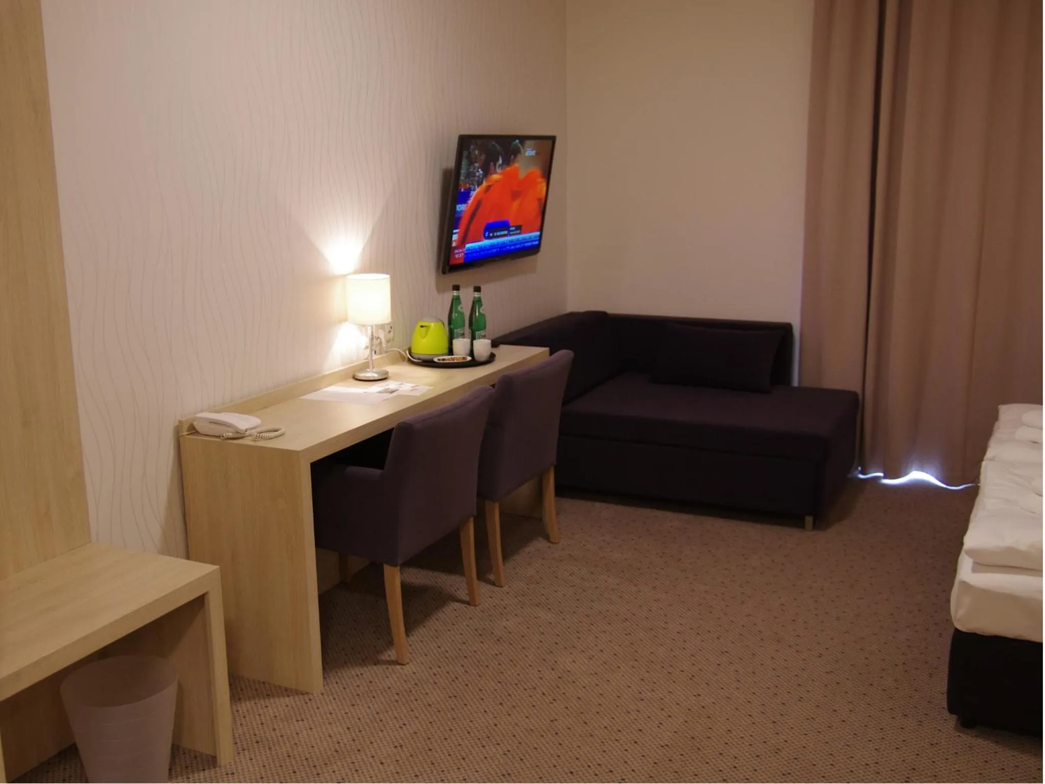 Seating area, Bed in Hotel Uniejów