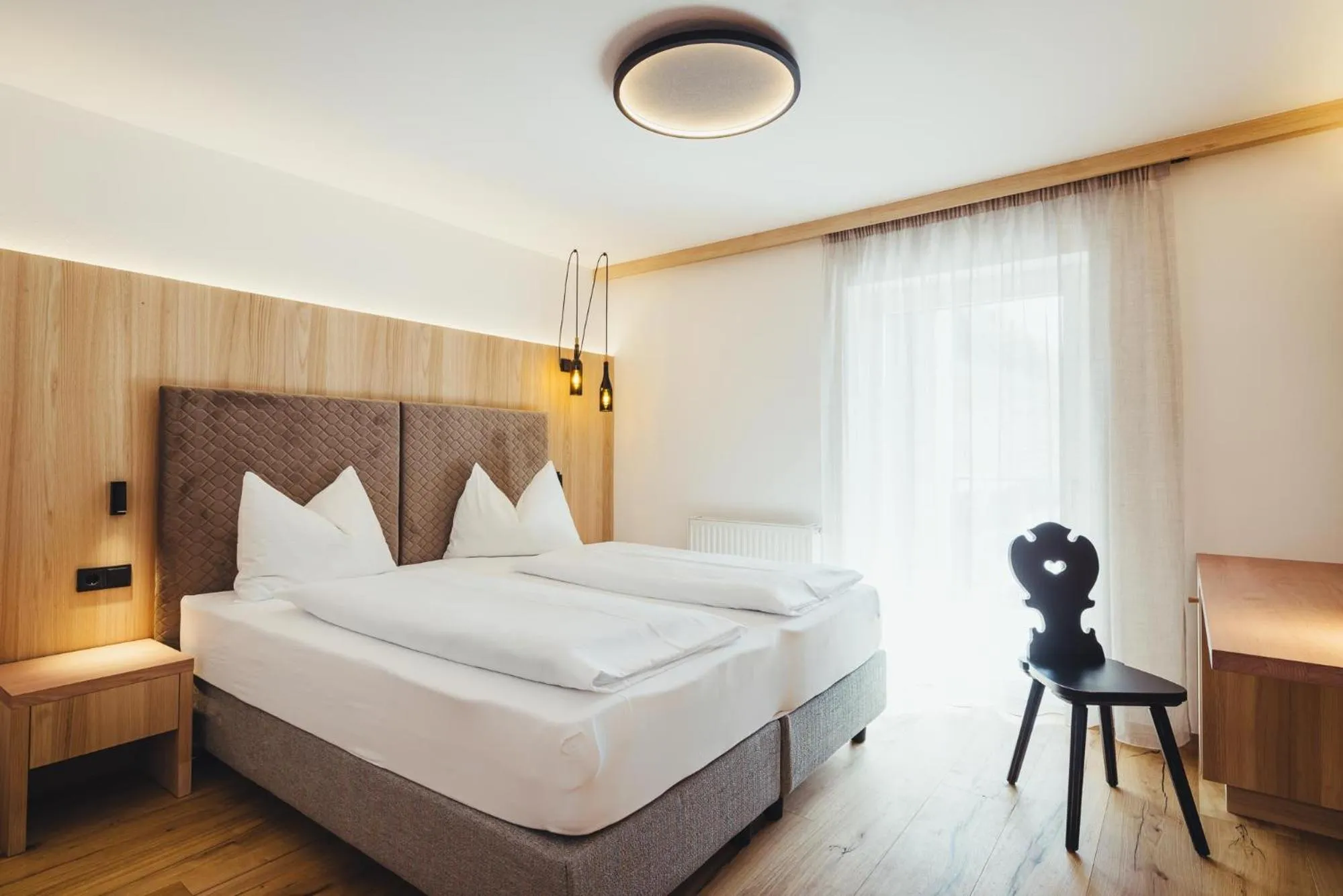 Photo of the whole room, Bed in Weingut & Genusshotel Spitalerhof Superior