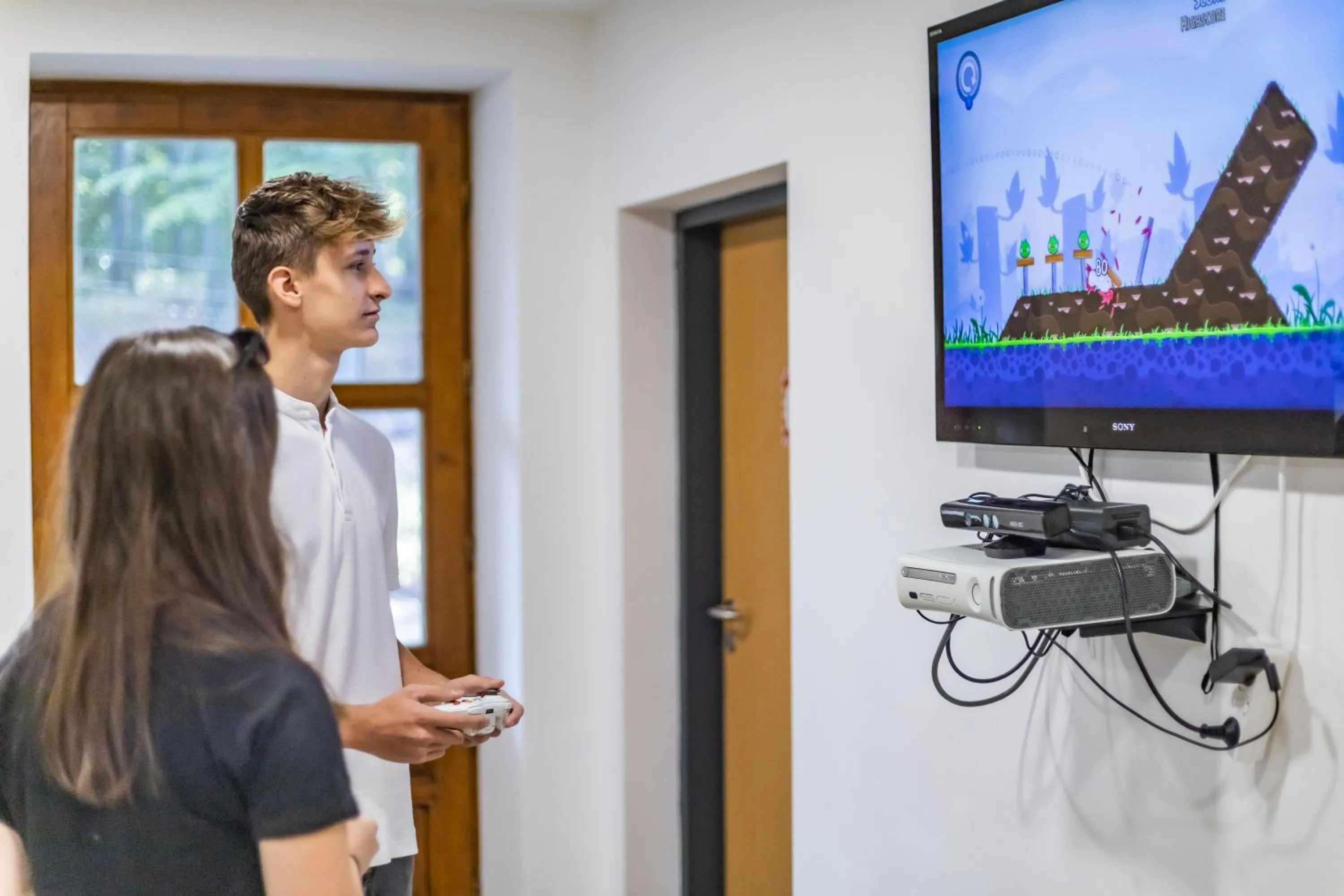 Communal lounge/ TV room in 4 Évszak Hegyihotel
