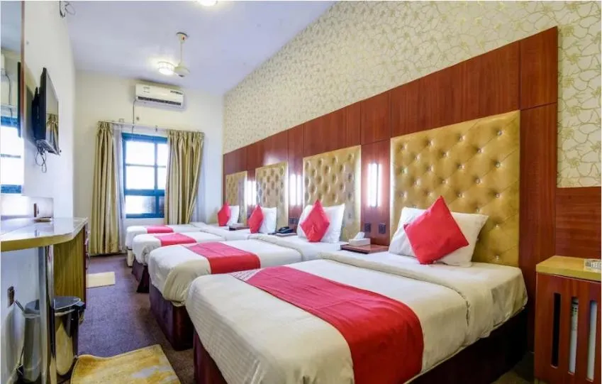 Bed in Parasol Hotel