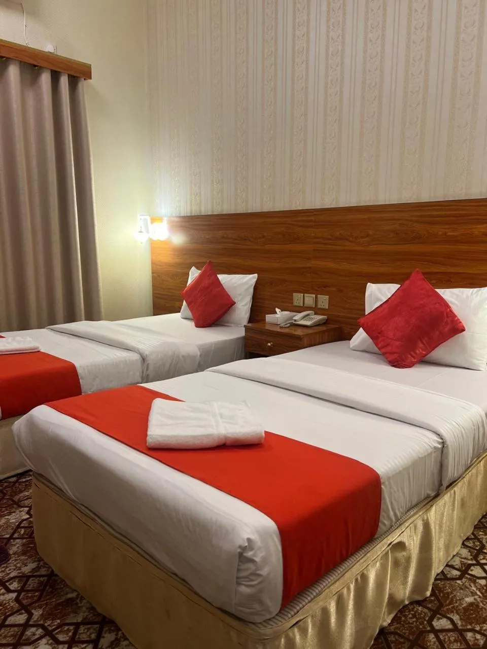 Bed in Parasol Hotel