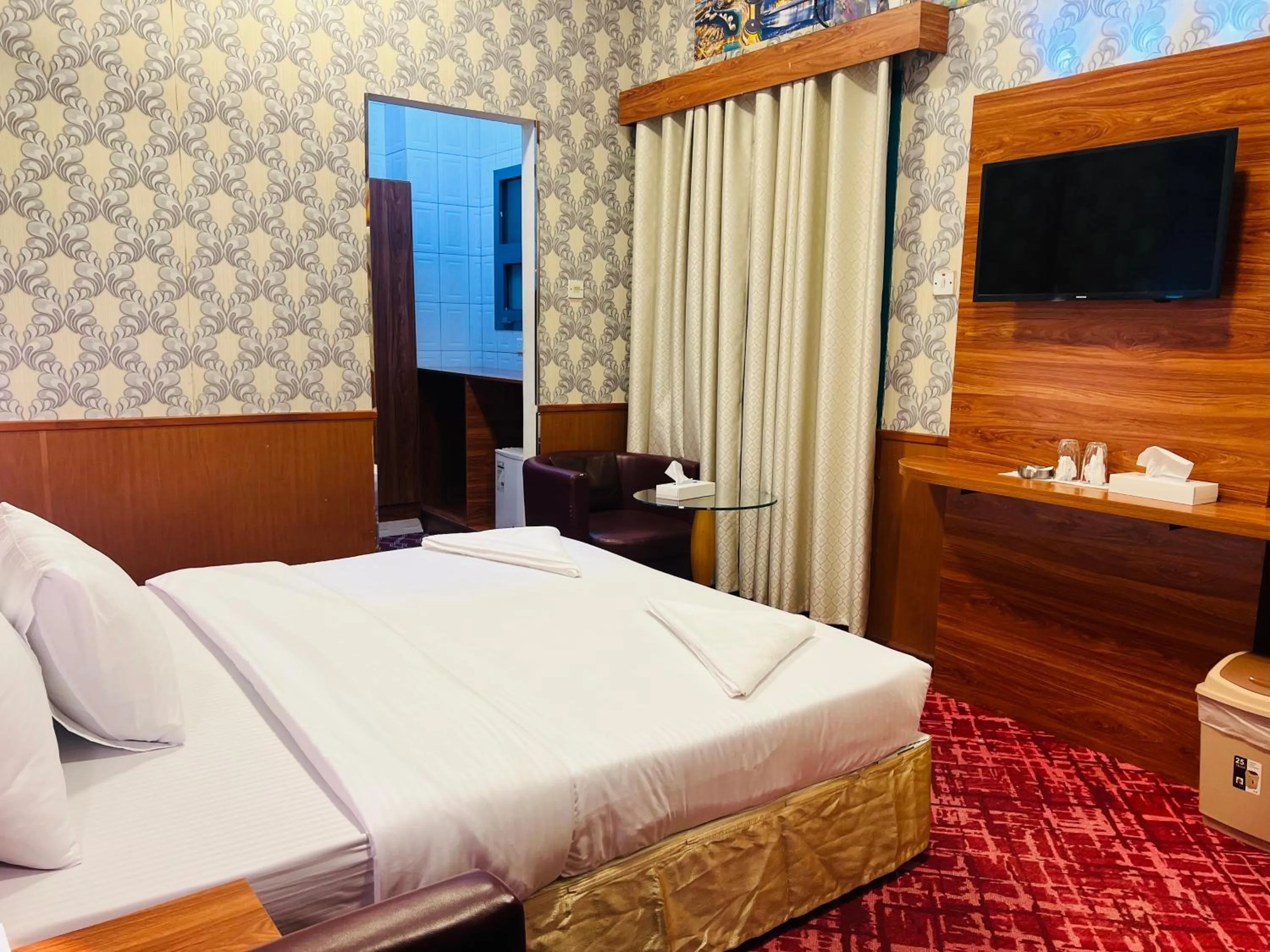 Bed in Parasol Hotel