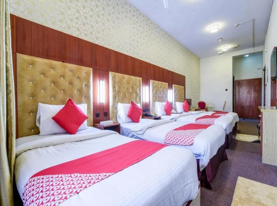 Bed in Parasol Hotel