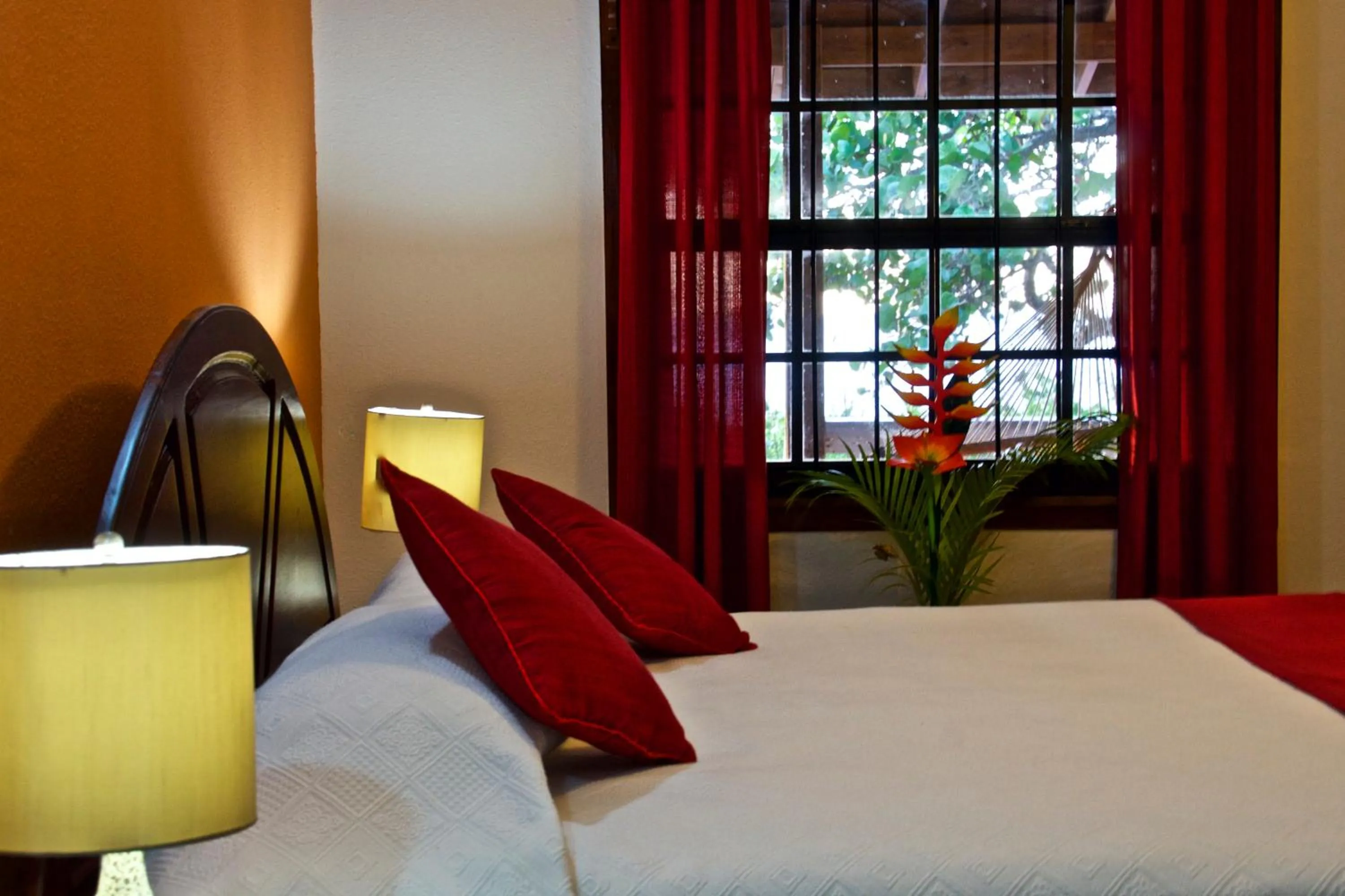 Bed in Seagrape Plantation Resort & Dive Center