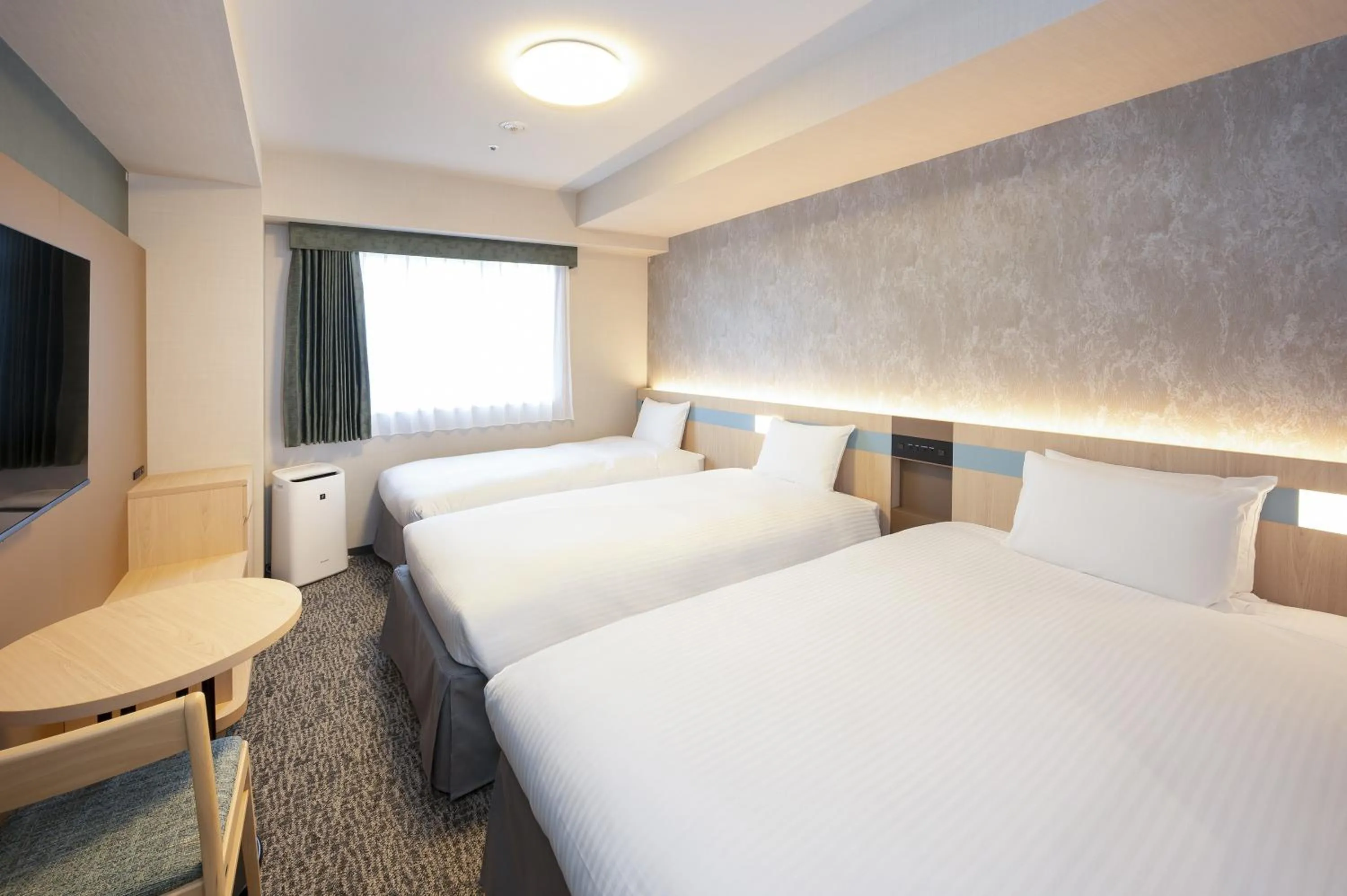 Bed in Hotel Lumiere Nishikasai