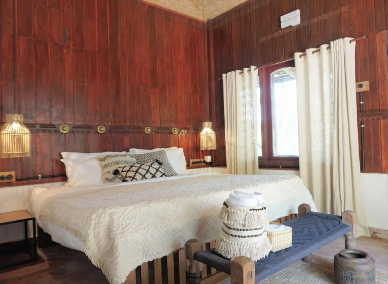 Bed in Sunsets and Palm Trees