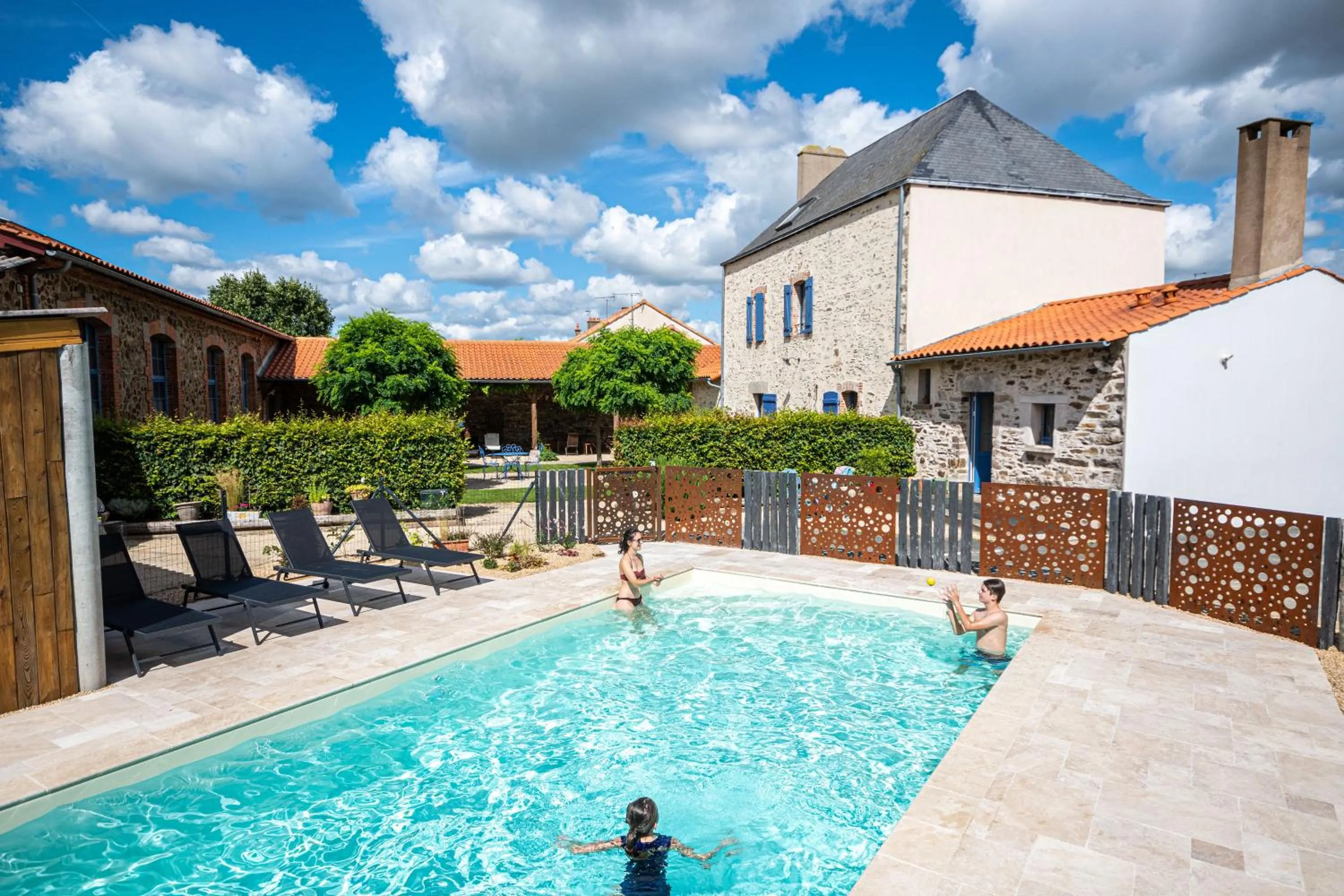 Swimming pool in Le DOMAINE DES ECOLIERS B&B
