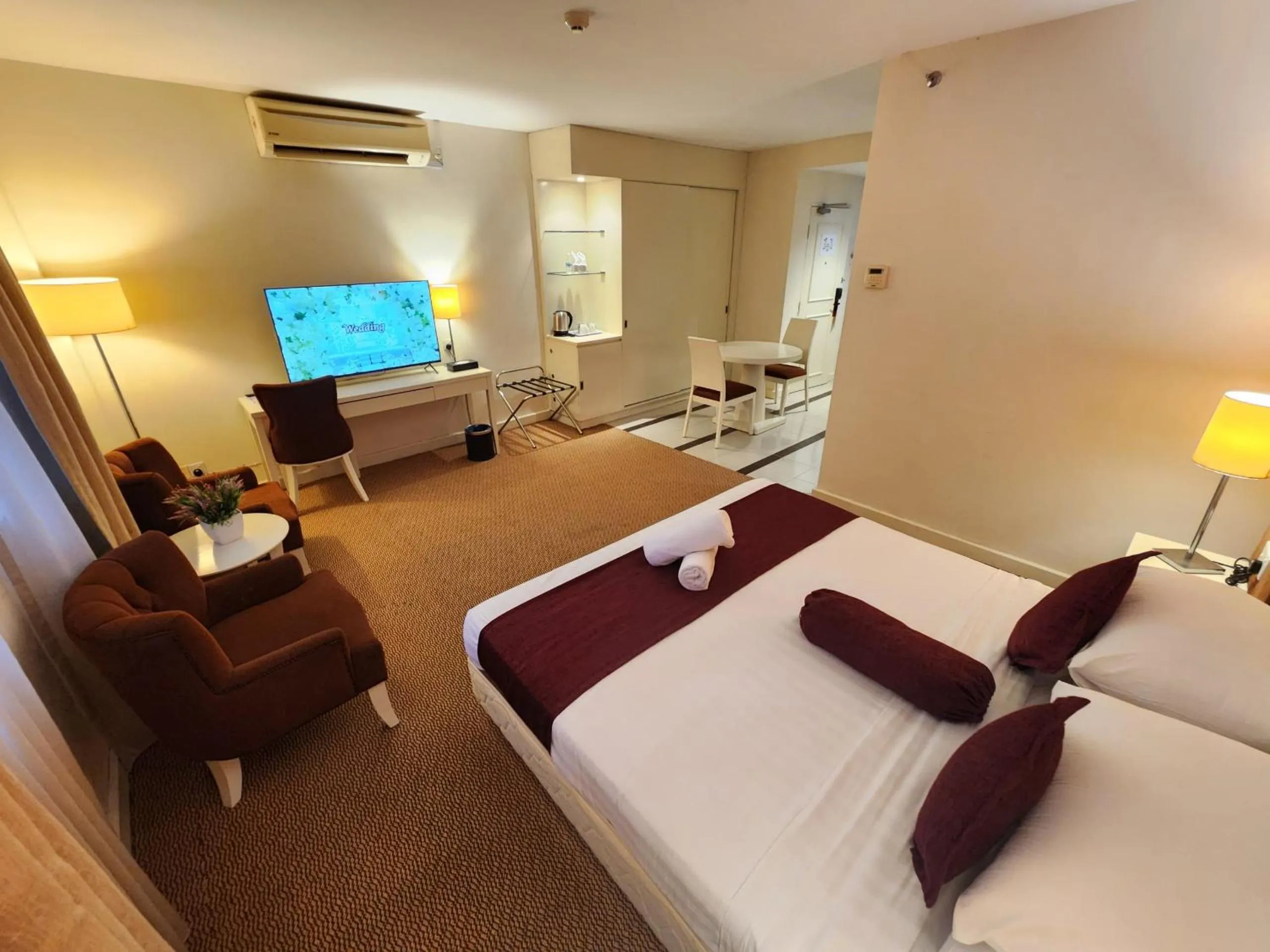 Bed in The Grand Puteri Hotel