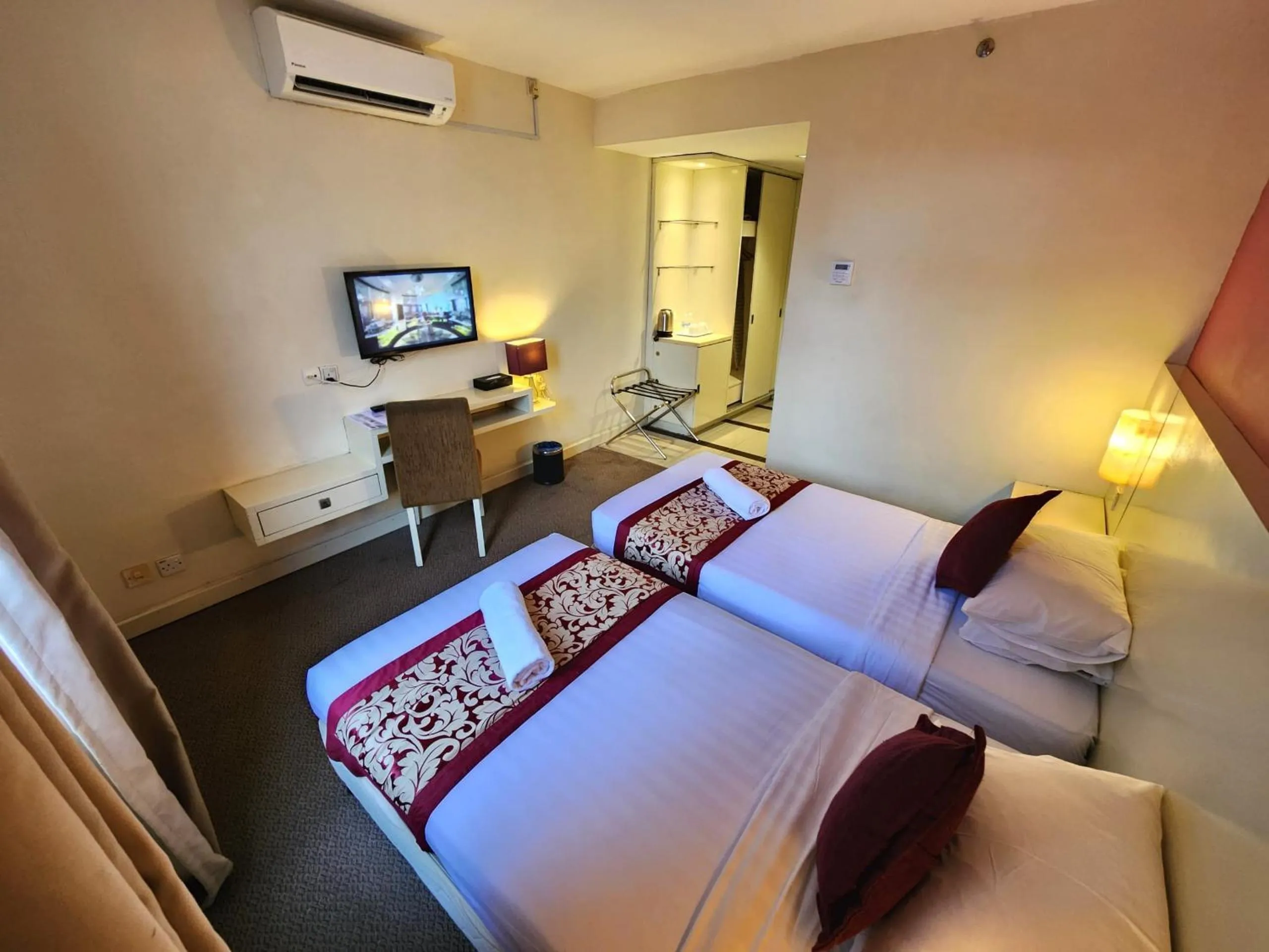 Bed in The Grand Puteri Hotel