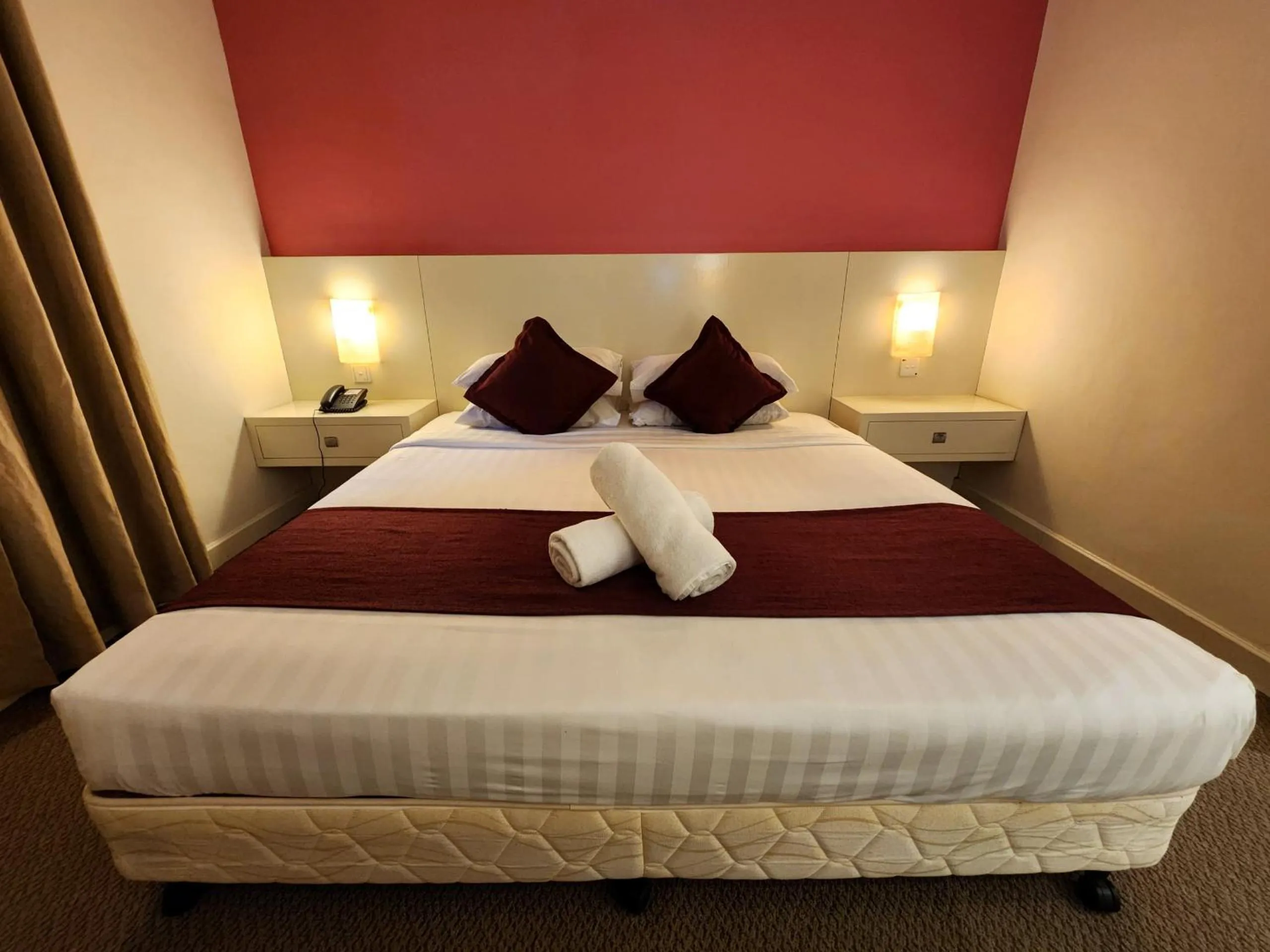 Bed in The Grand Puteri Hotel