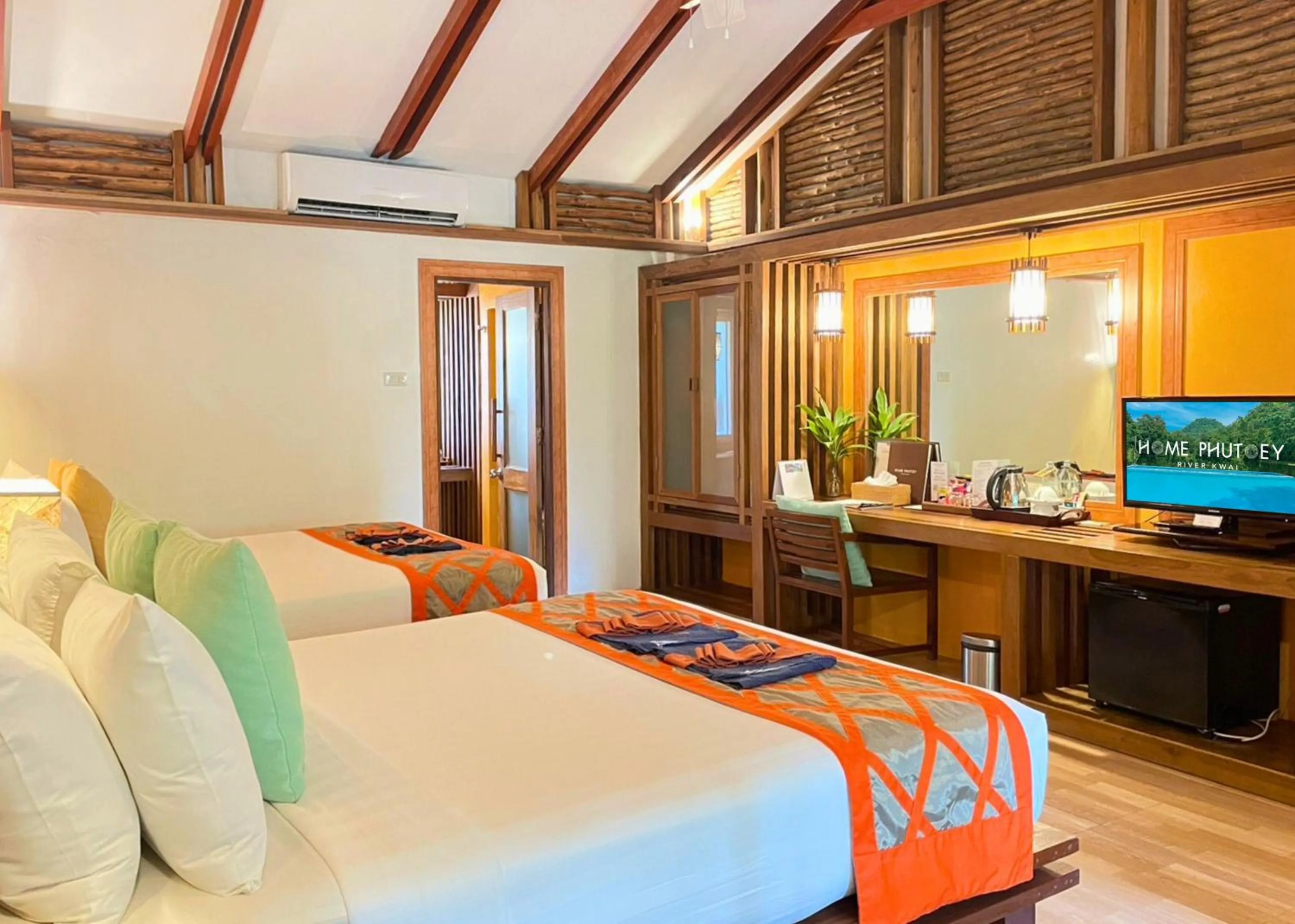 Bed in Home Phutoey River Kwai Hotspring & Nature Resort