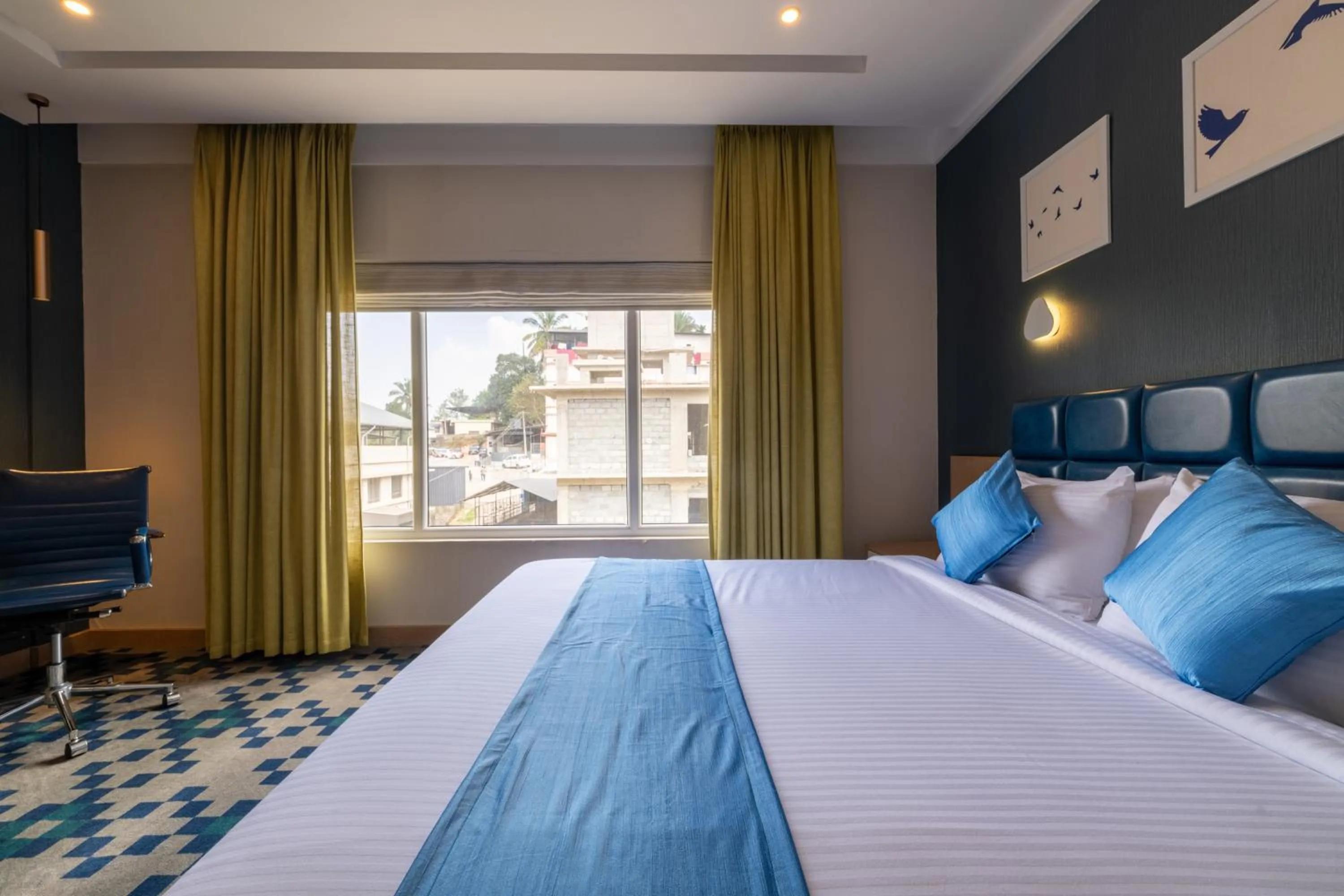 Bed in Mintotel Wayanad