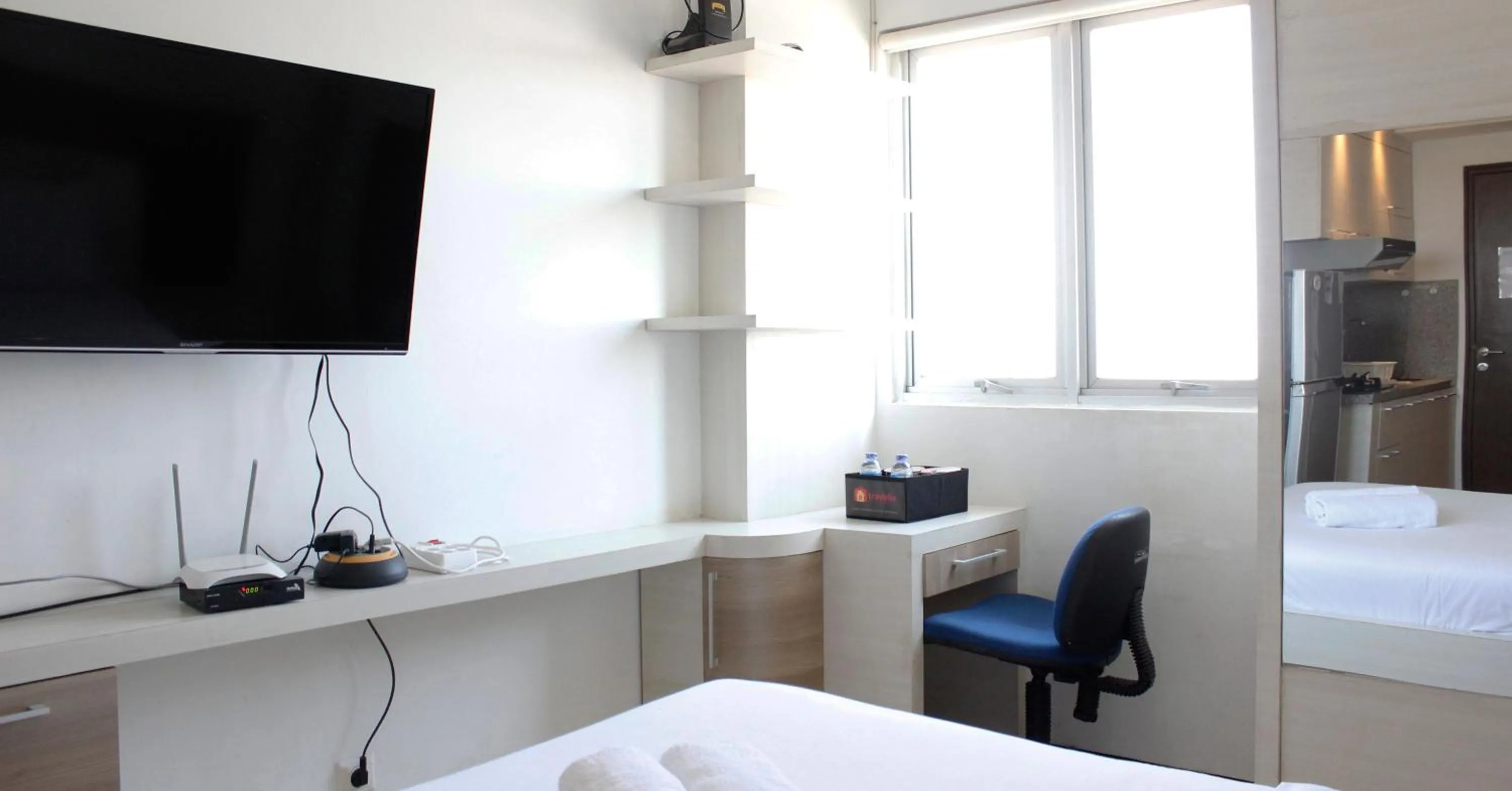 Bed in Minimalist Studio Apartment at The Suite @Metro By Travelio