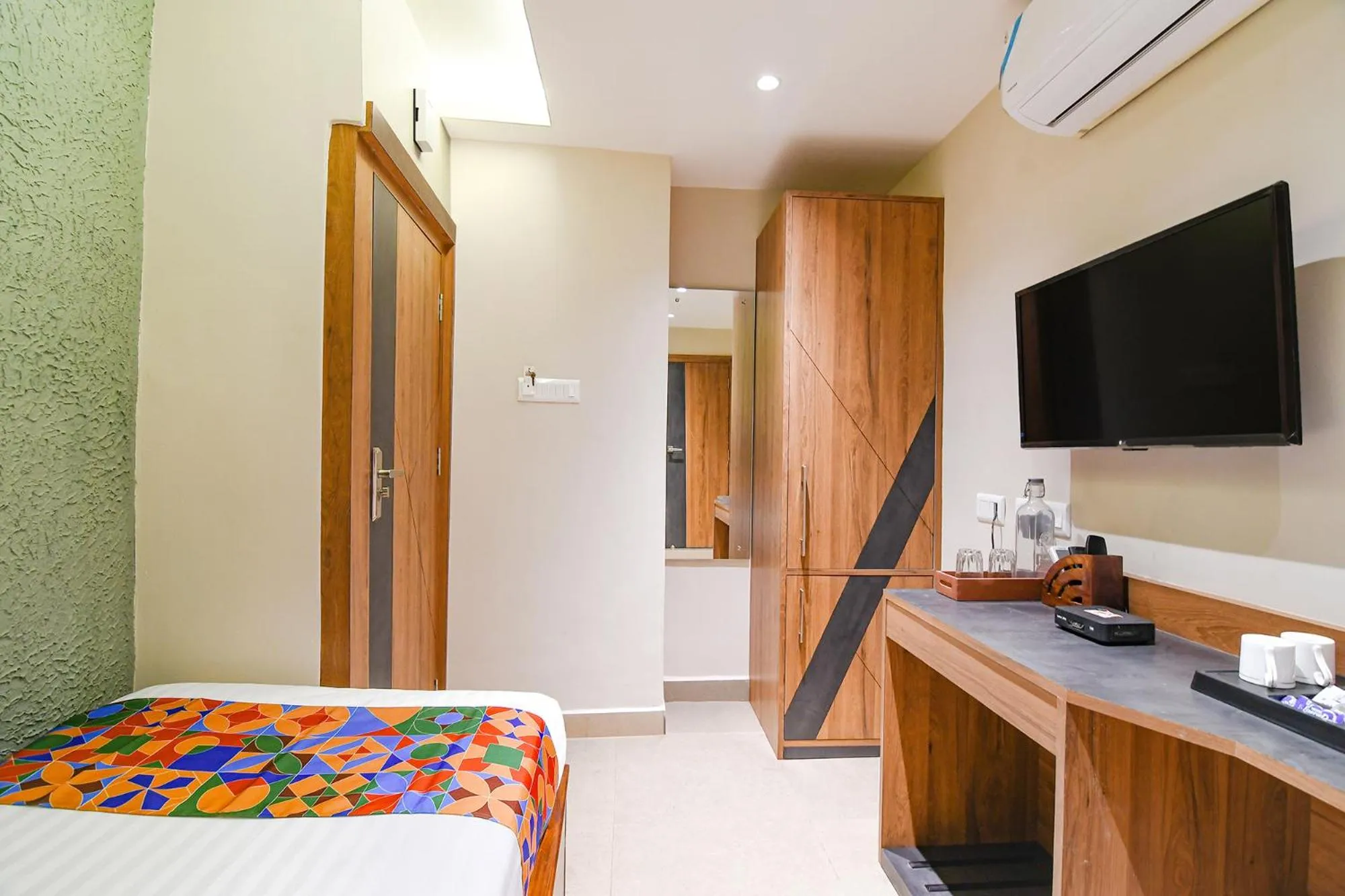 Bed in FabHotel Prime Swagatam International Chinar Park