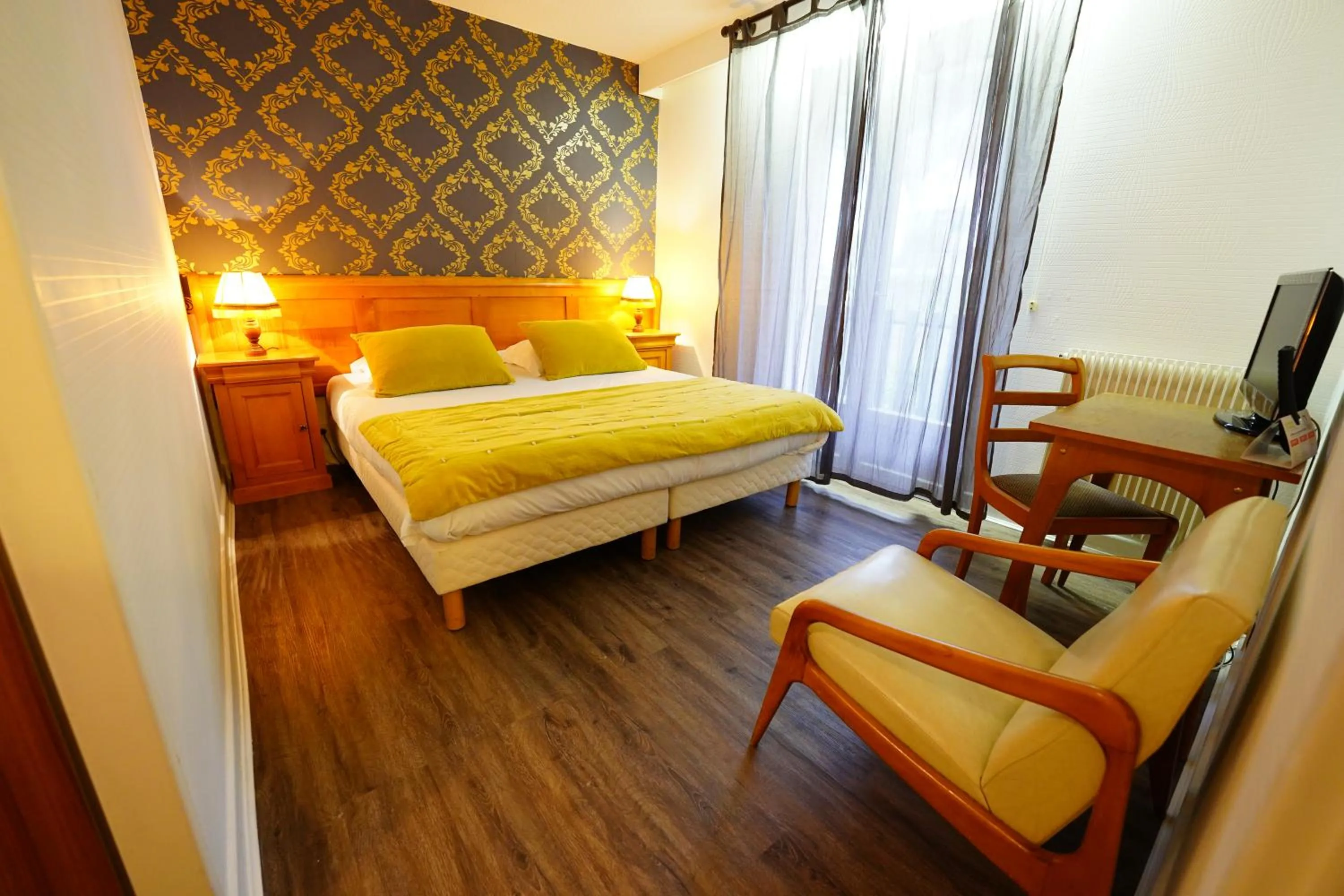 Bed in Logis Hôtel Le Griou