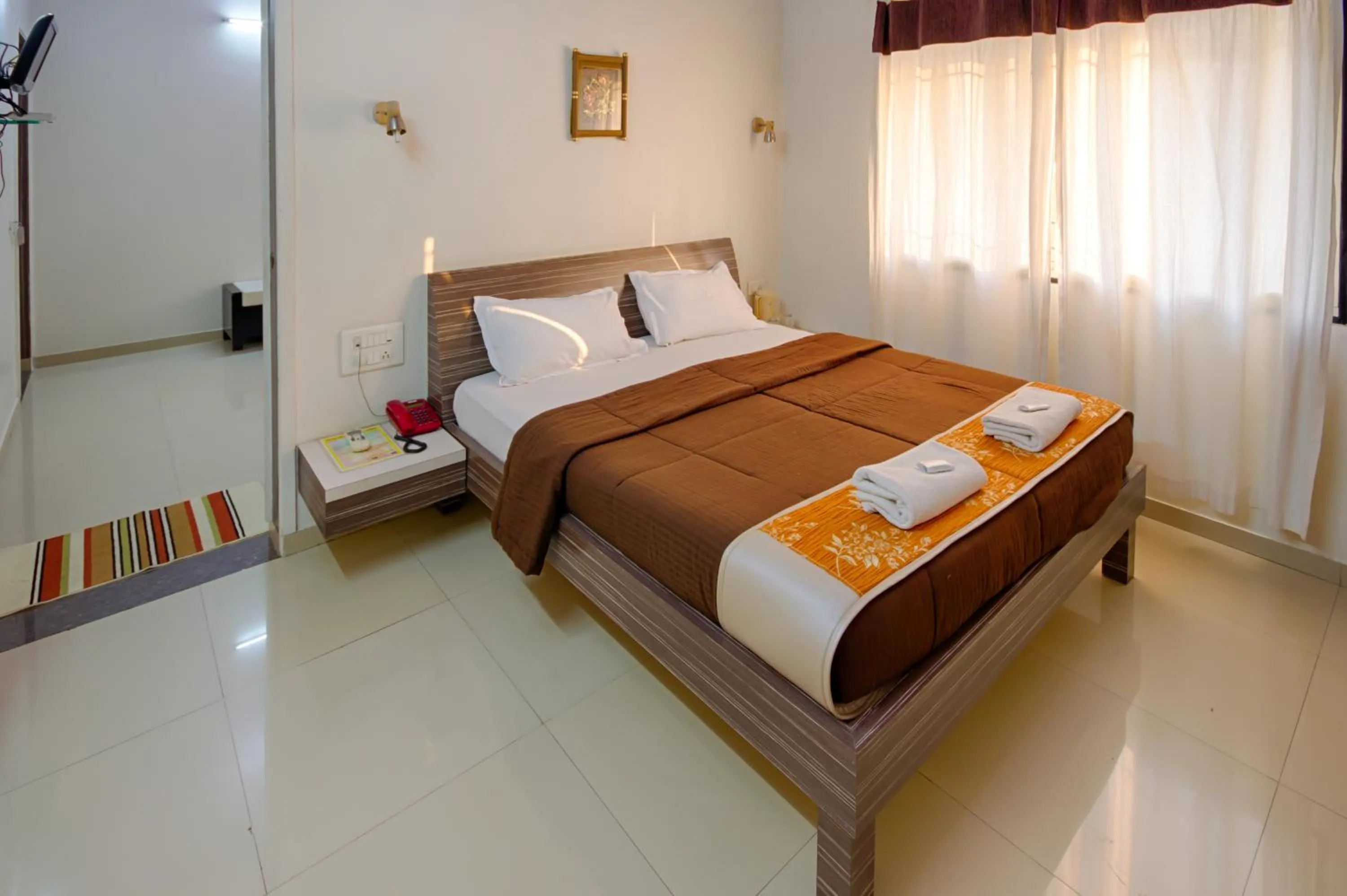 Bed in Hotel Grand Ashwin