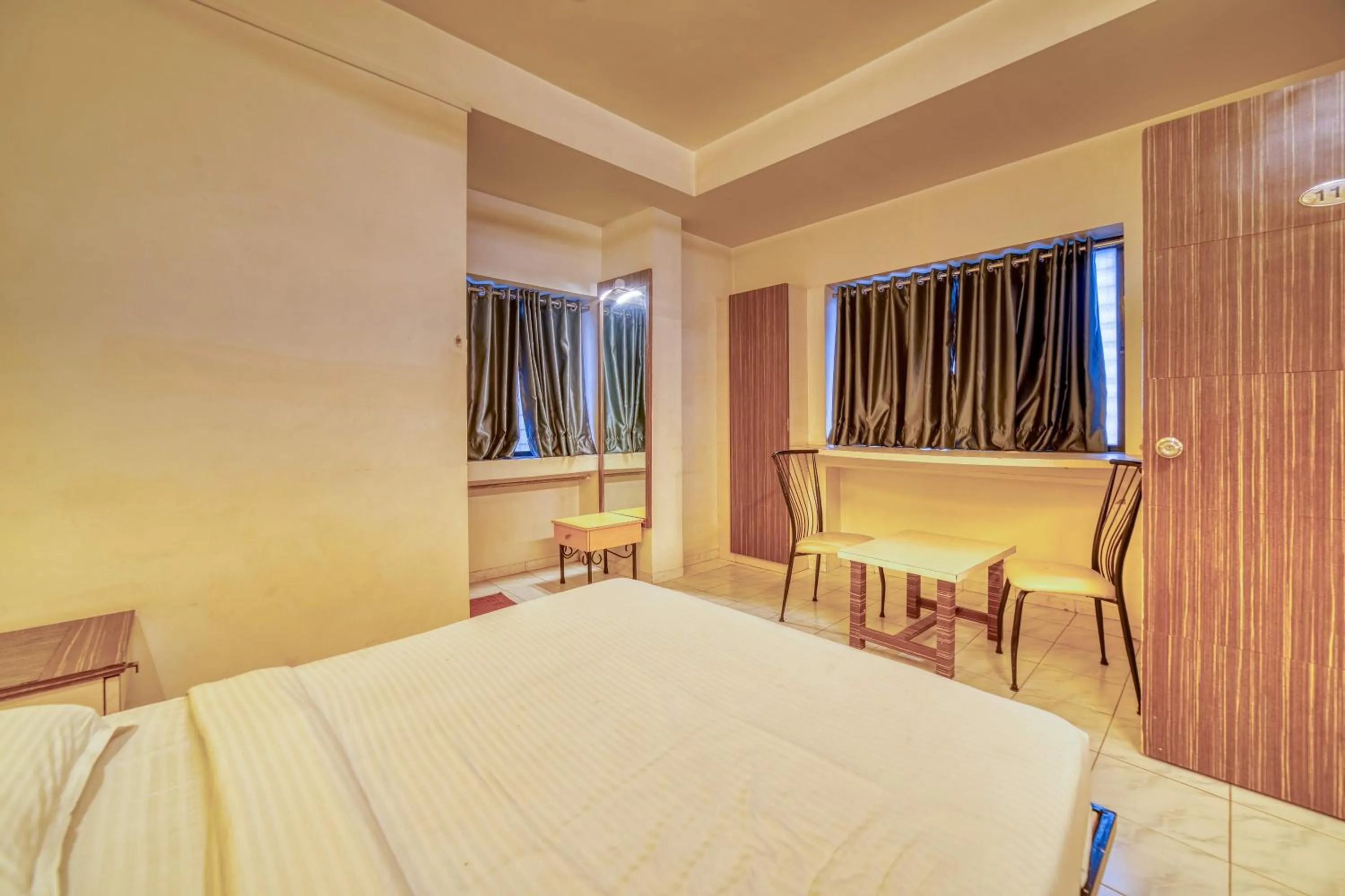 Seating area, Bed in Hotel Grand Ashwin