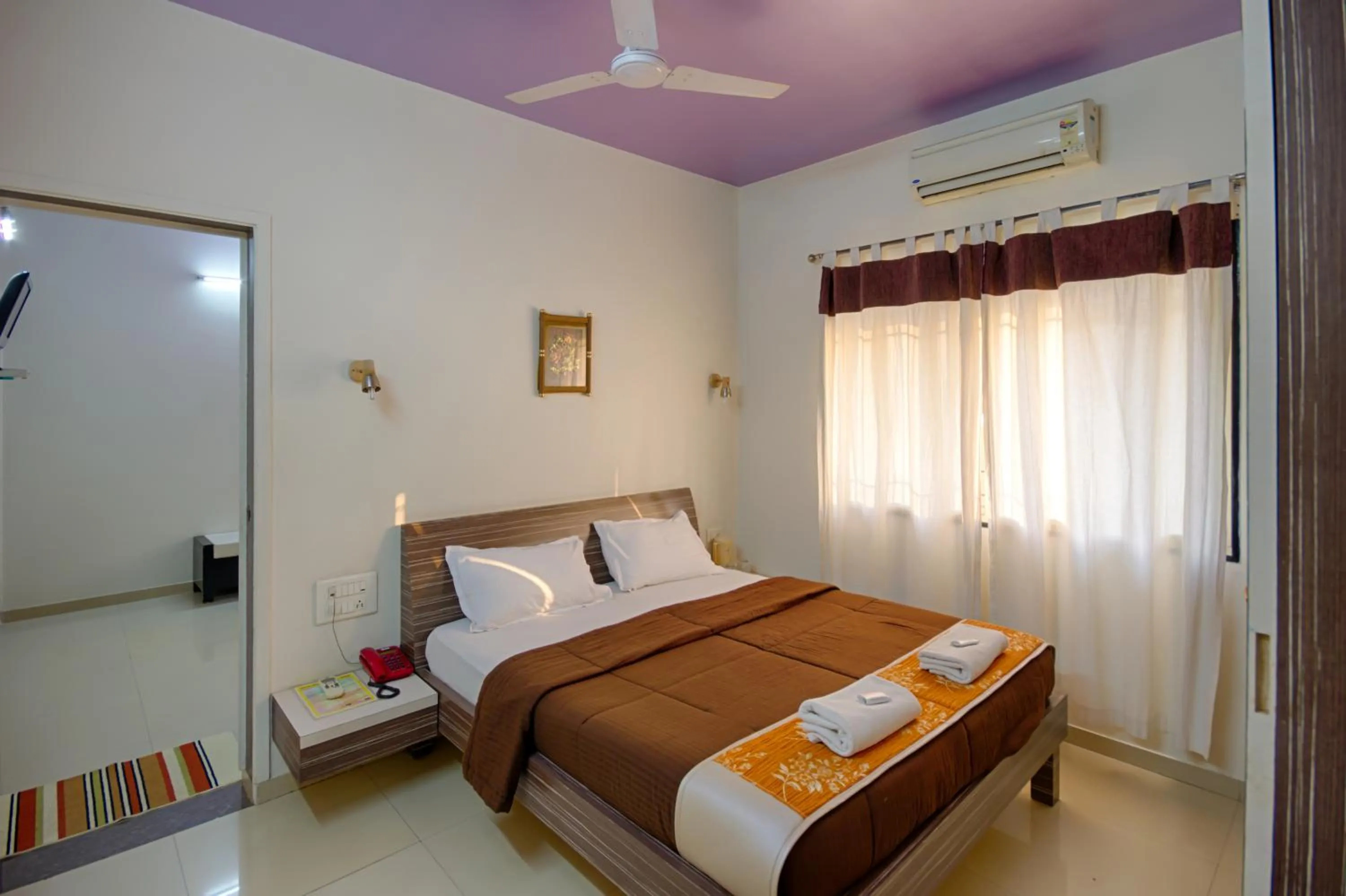 Bed in Hotel Grand Ashwin