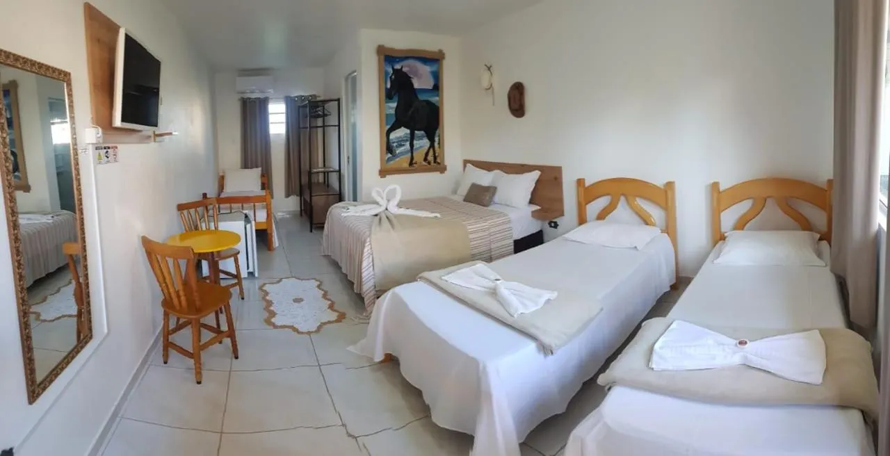 Bed in Pousada Alegria do Cowboy