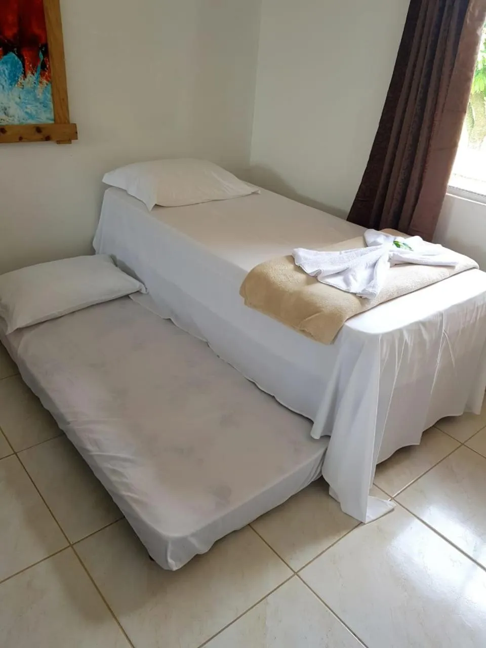 Bed in Pousada Alegria do Cowboy