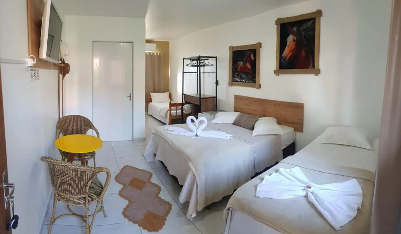 Bed in Pousada Alegria do Cowboy