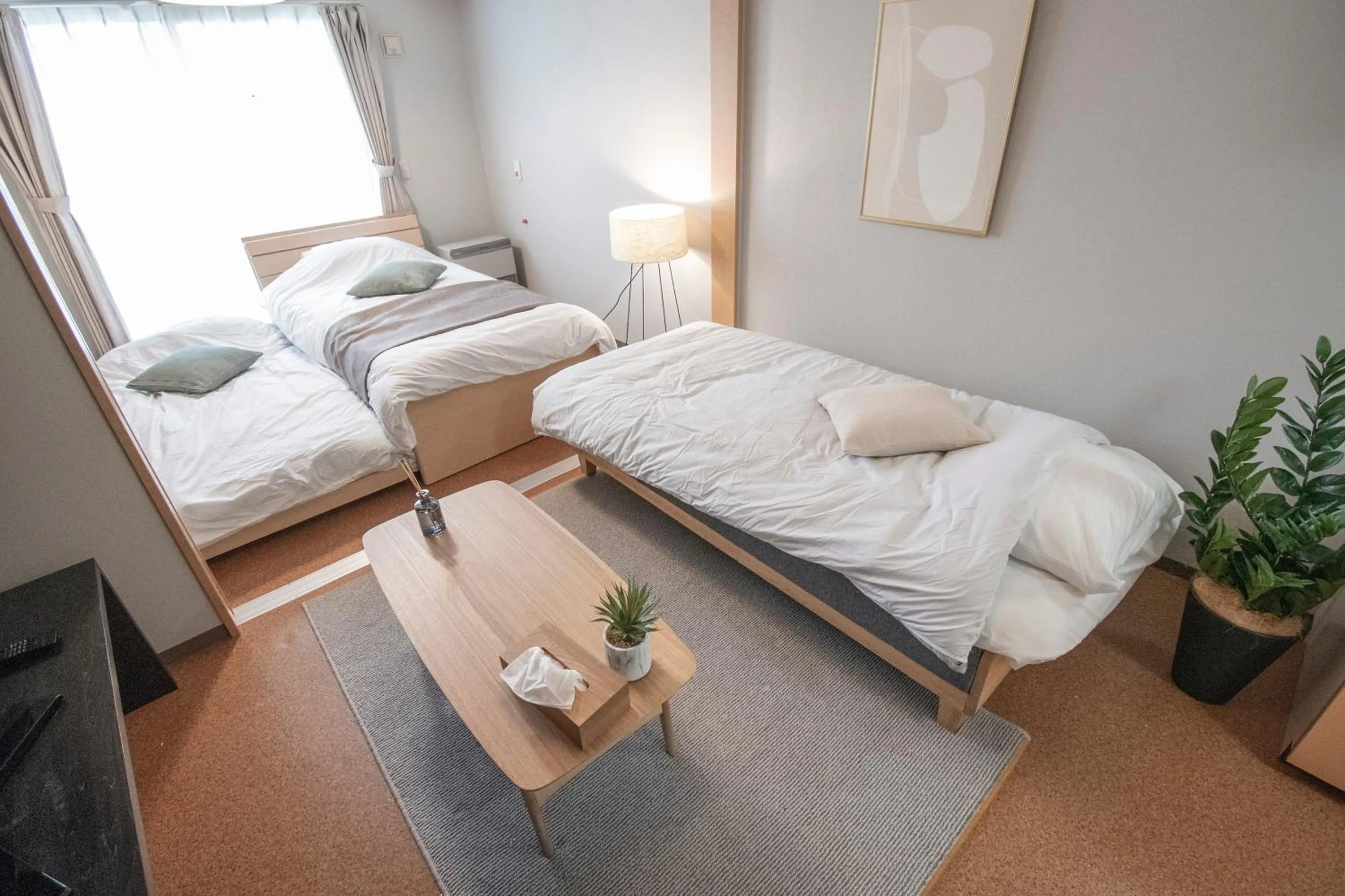 Bed in UCHI Living Stay Otaru Suitengu