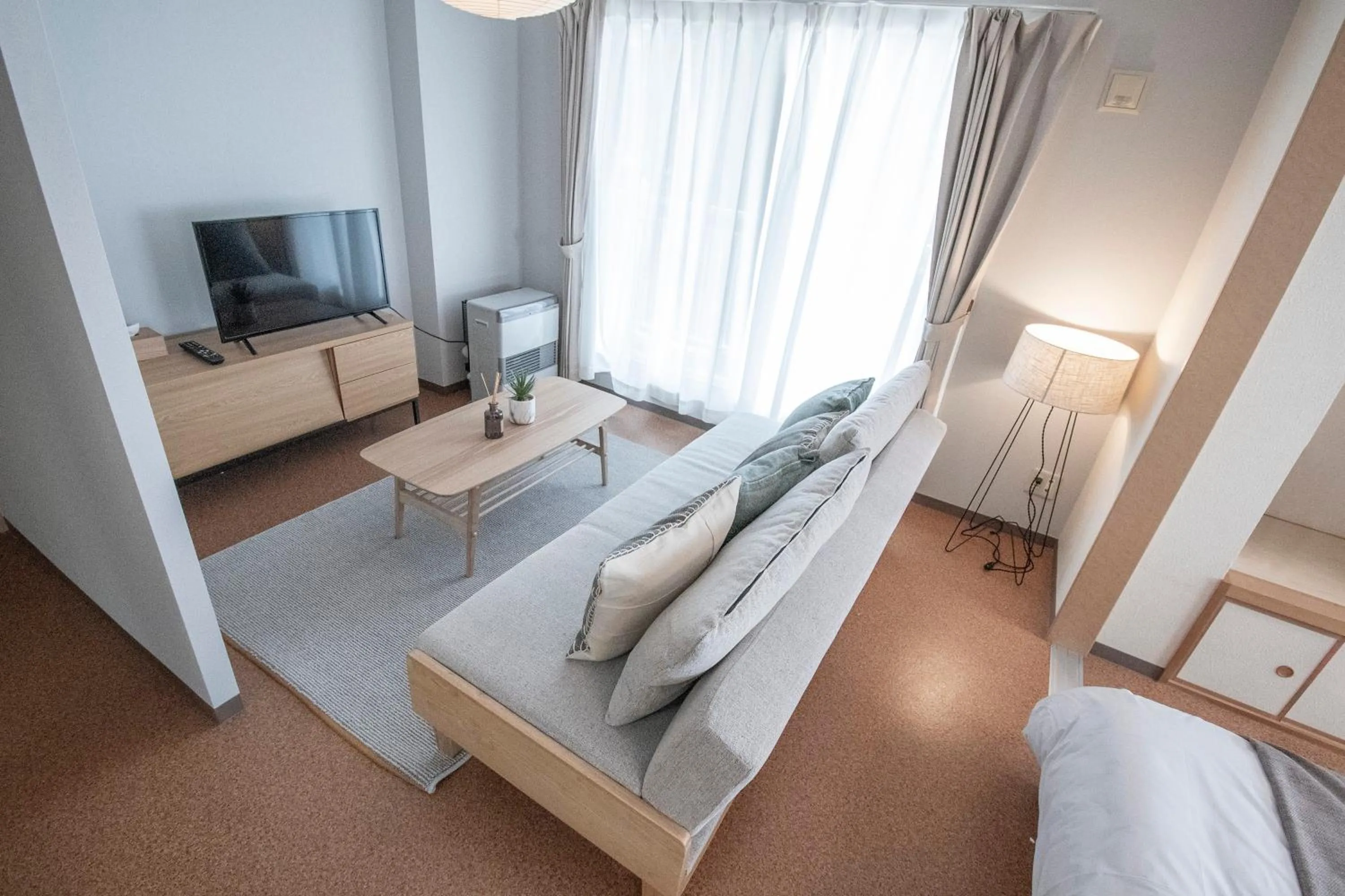 Living room, Bed in UCHI Living Stay Otaru Suitengu