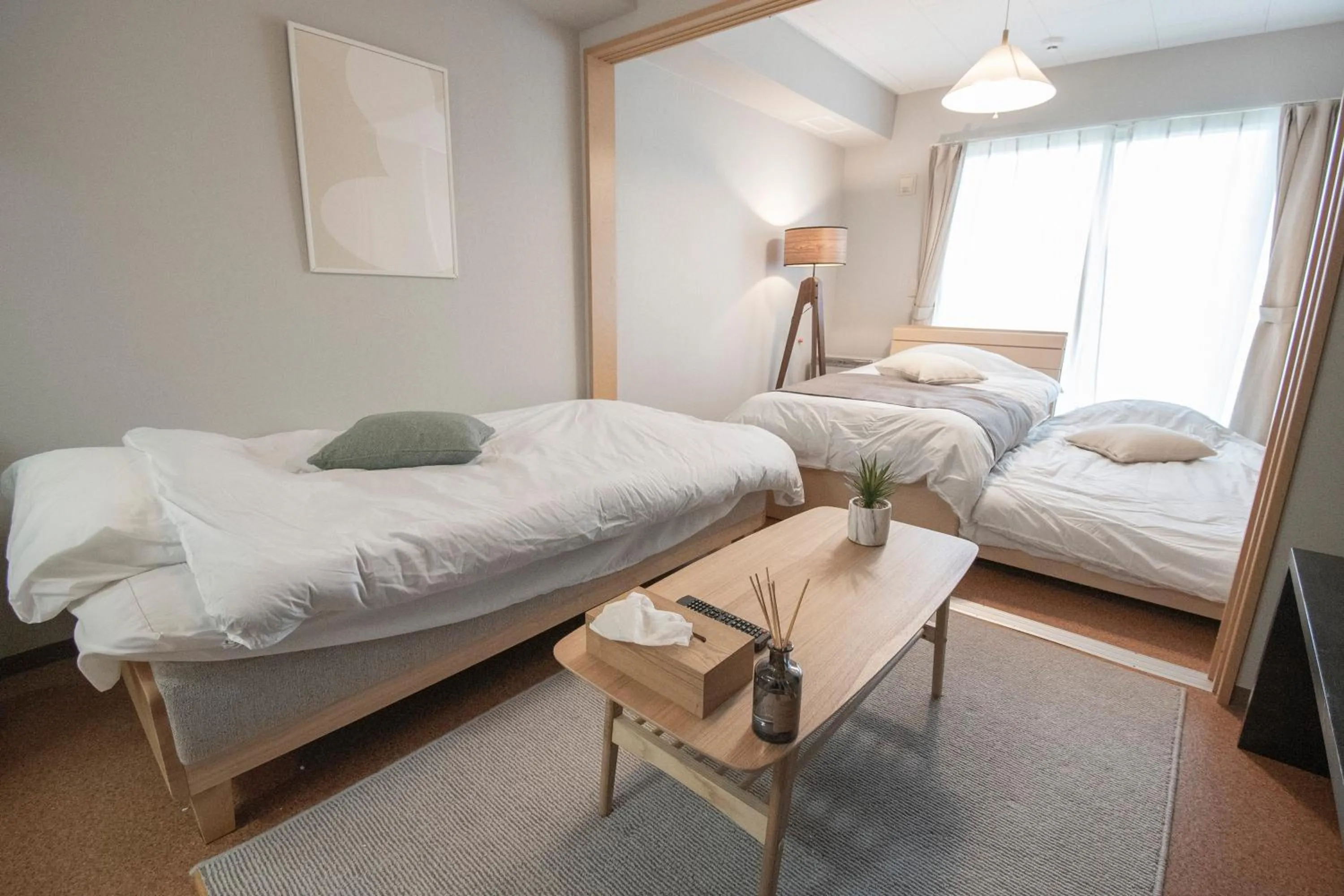 Bed in UCHI Living Stay Otaru Suitengu