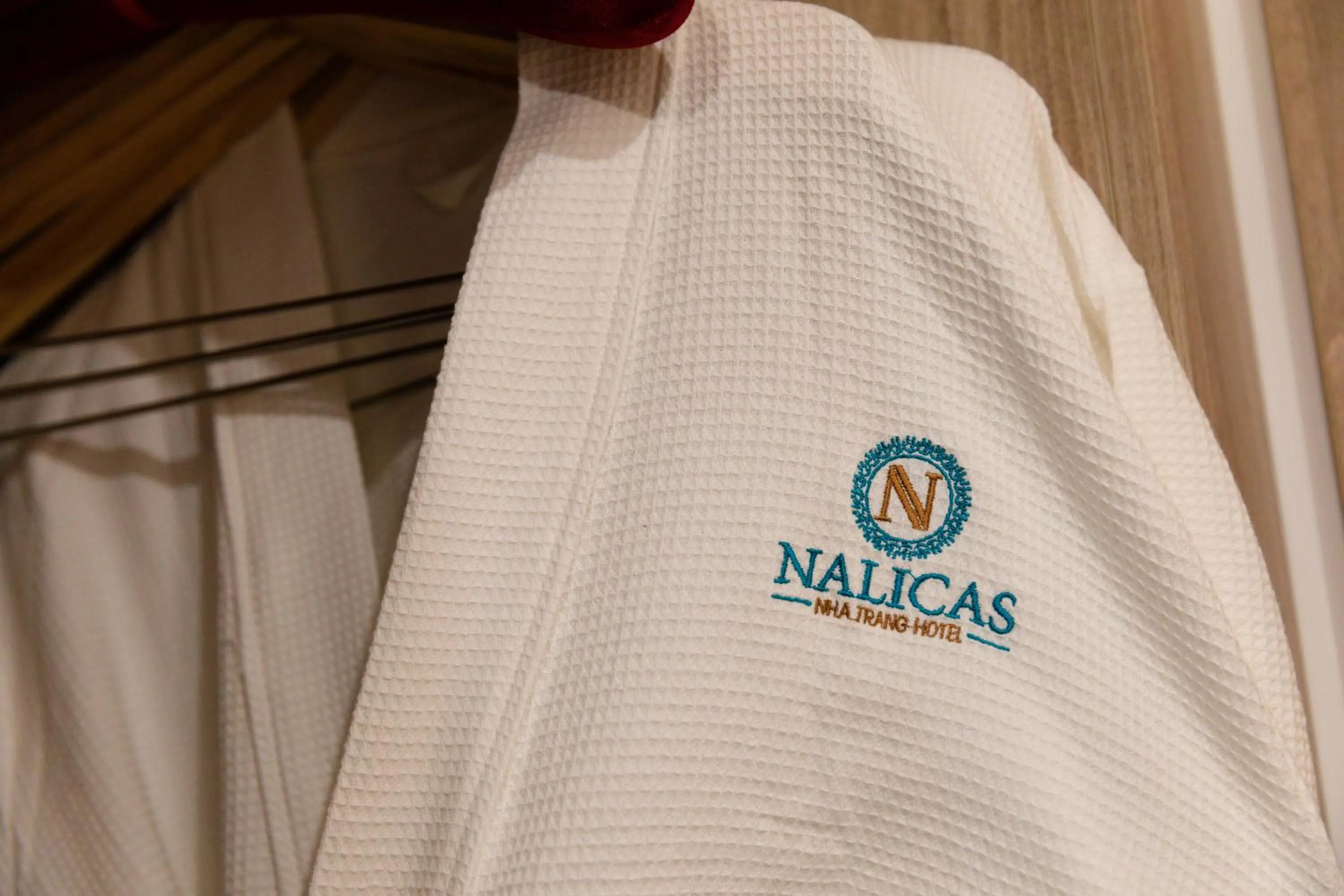 Property logo or sign in Nalicas Nha Trang Hotel