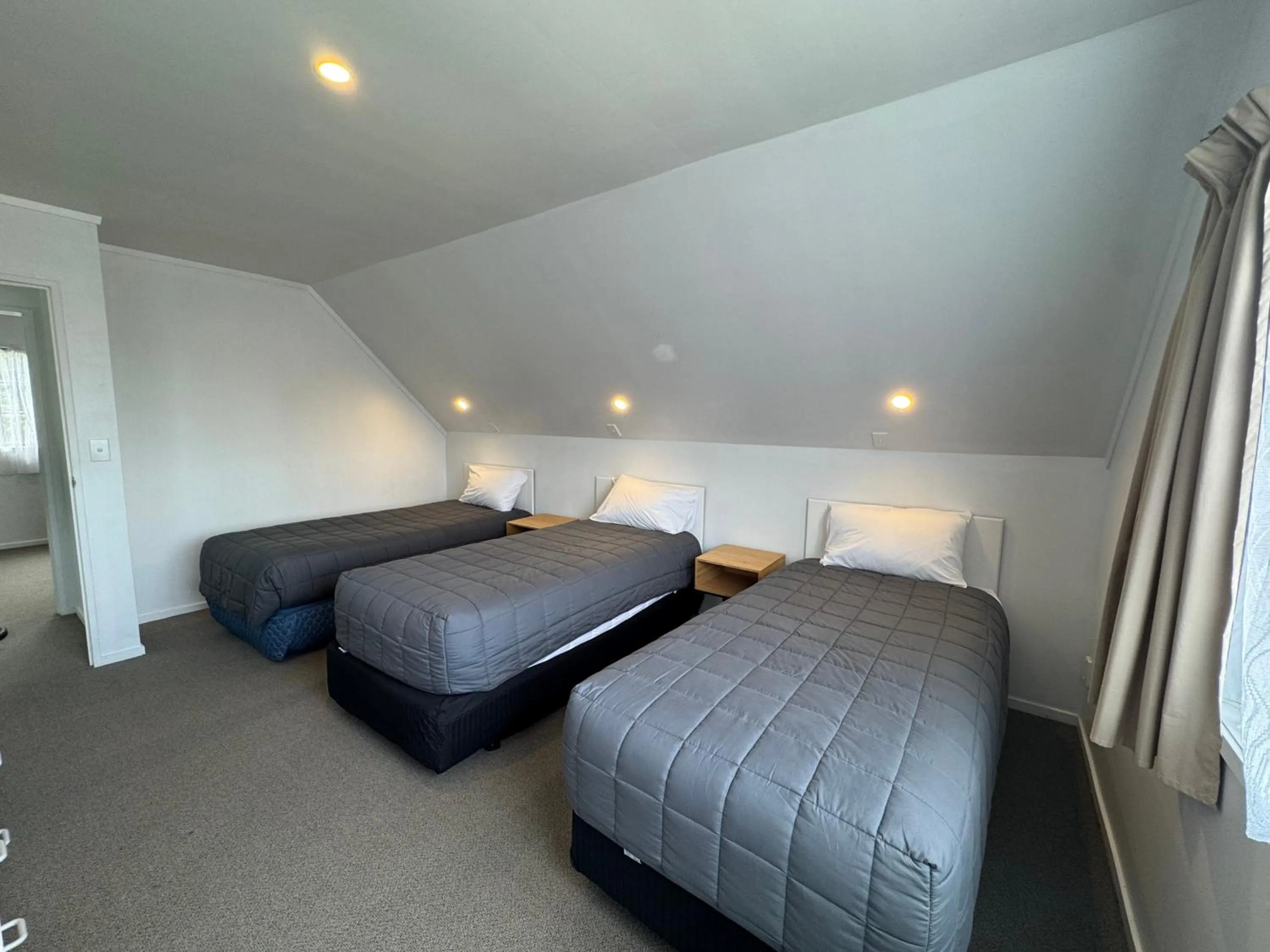 Bed in Camellia Court Motel