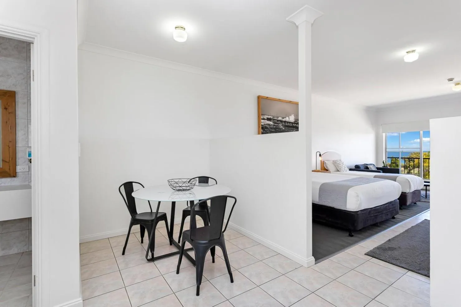 Seating area, Bed in Coast Motel and Apartments