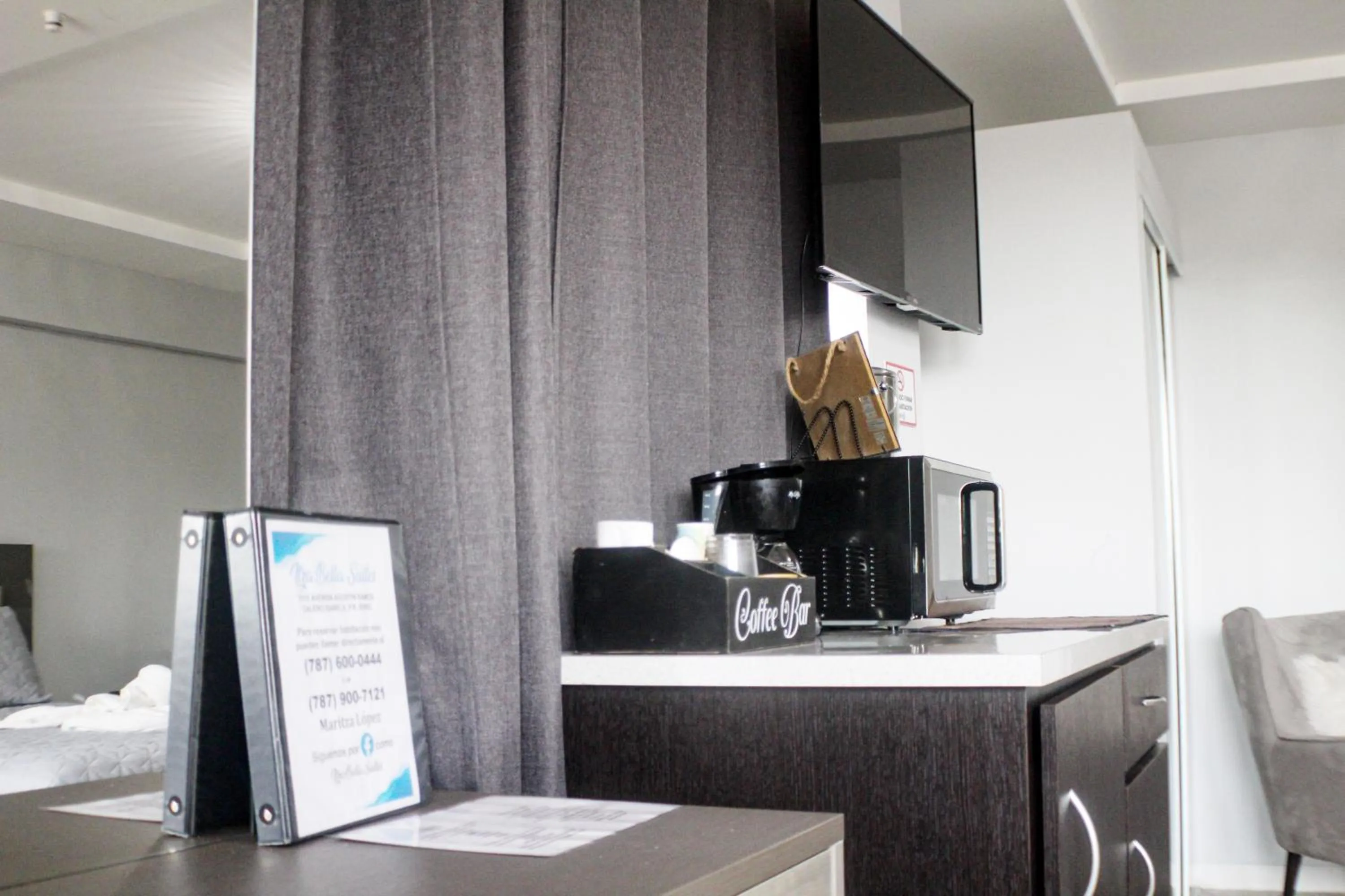 Bed in Itza-Bella Suites