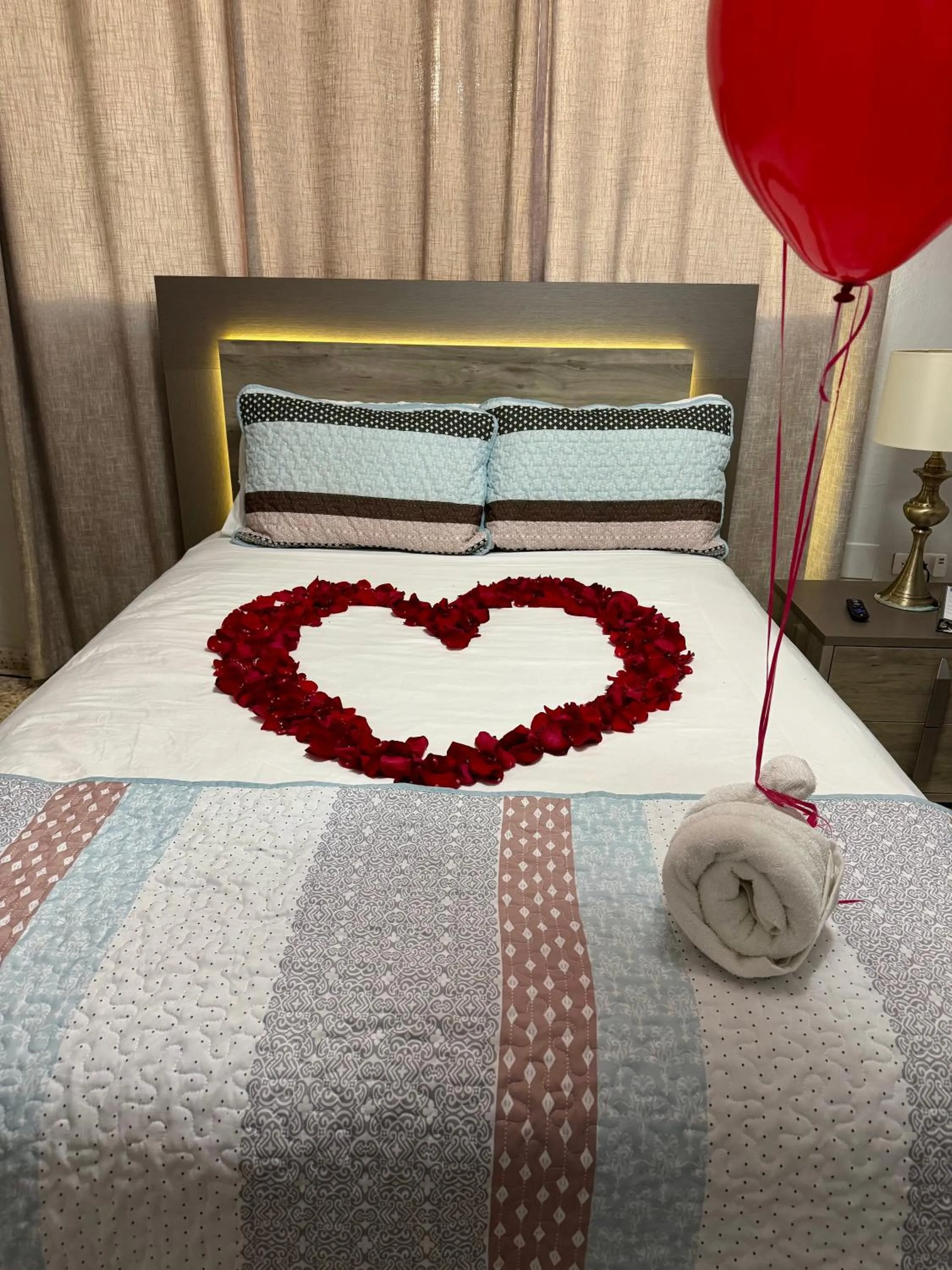 Bed in Itza-Bella Suites