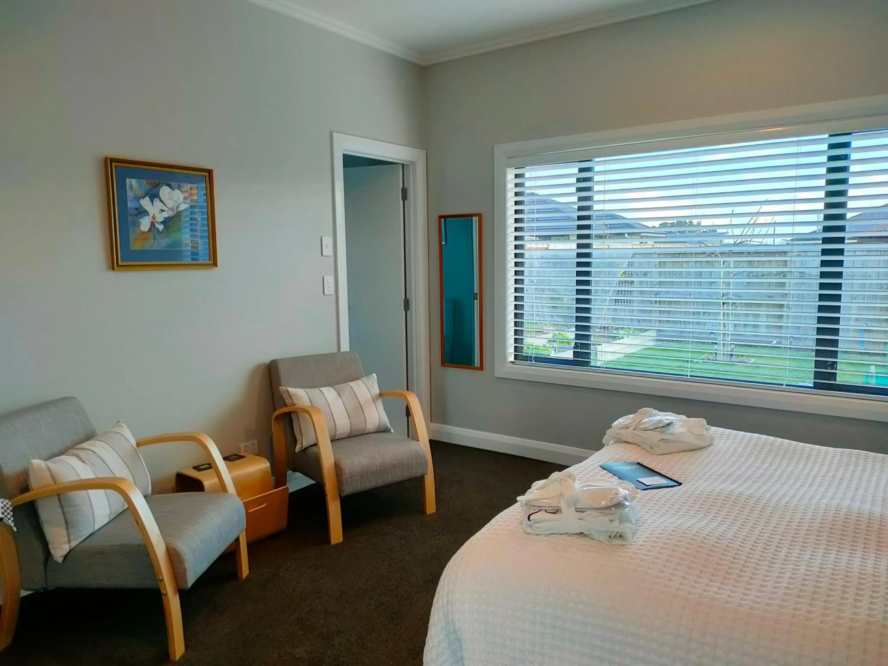 Seating area, Bed in Stay Taupo