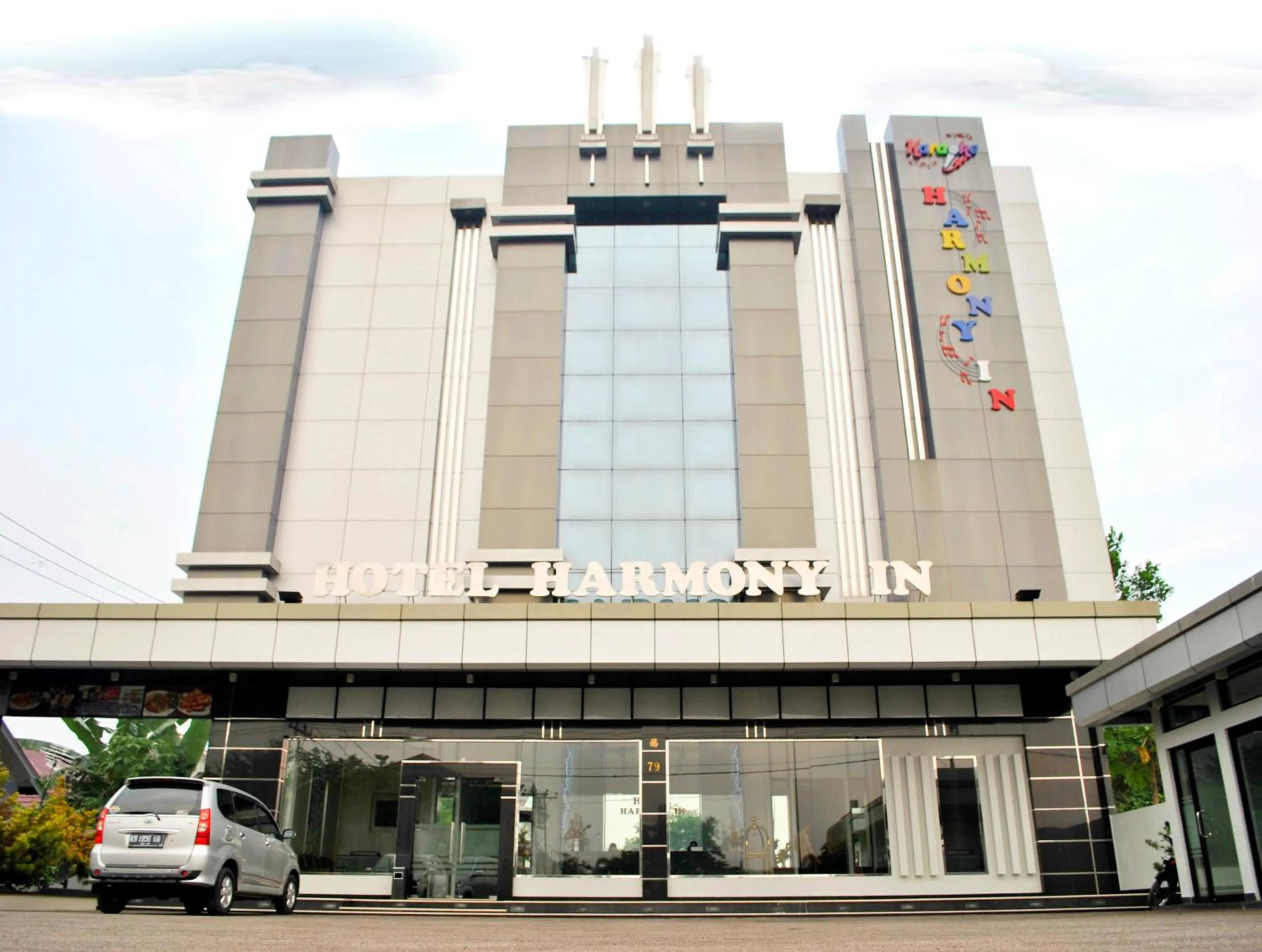 Property building in Hotel Harmony In & Karaoke