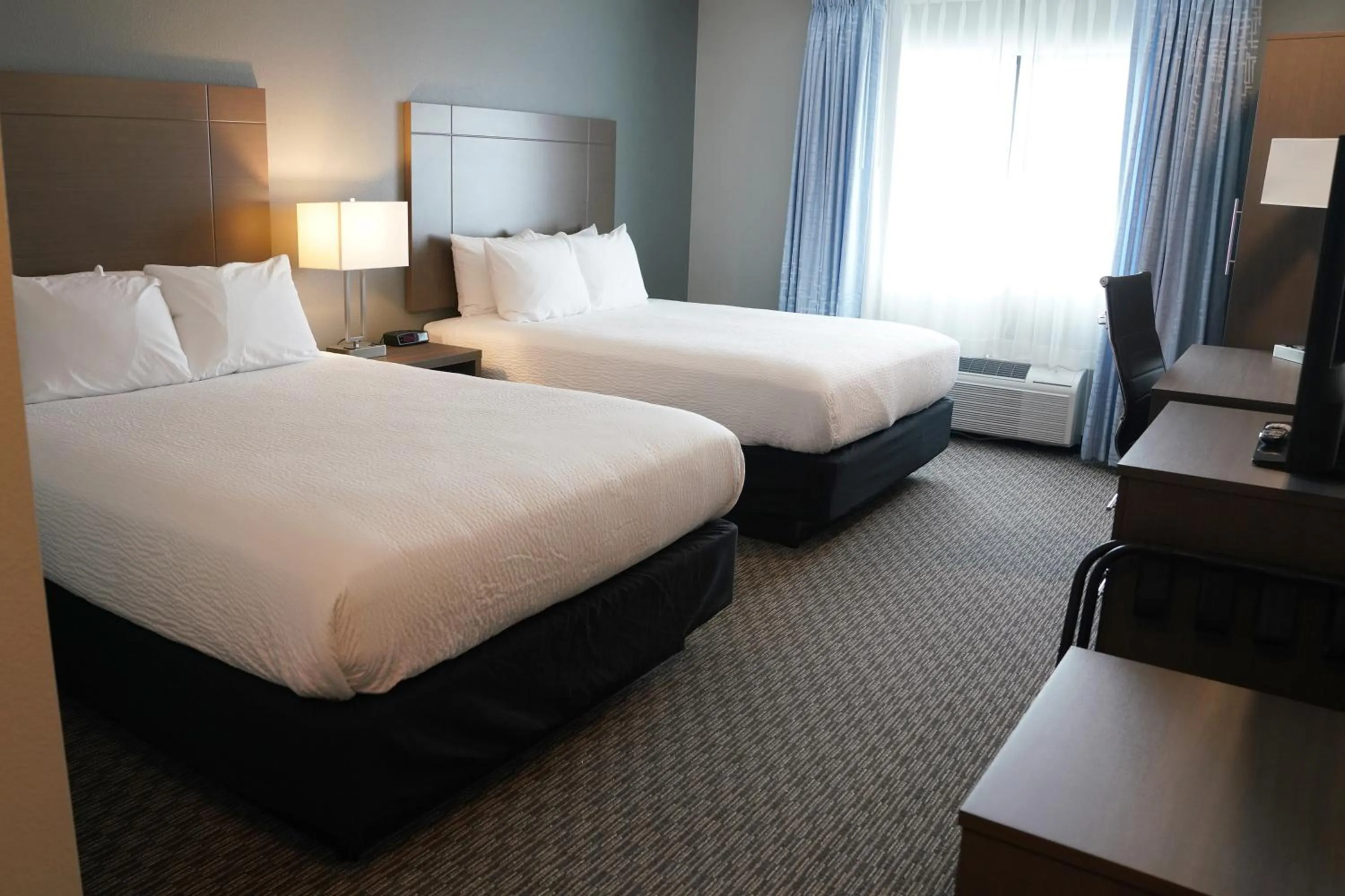 Bedroom, Bed in Brookstone Inn & Suites