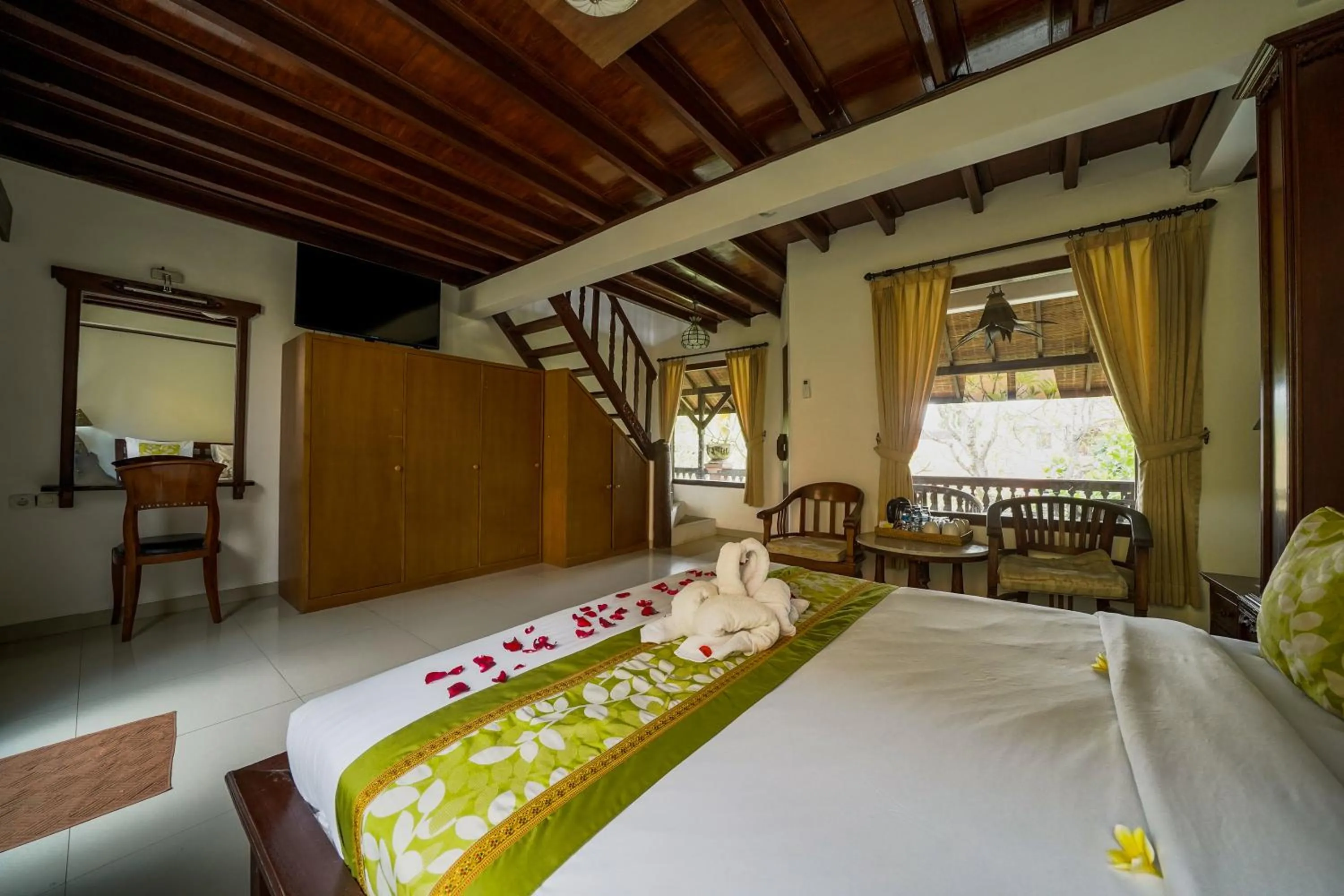 Bed in Three Brothers Bali Legian Bungalows & Villas