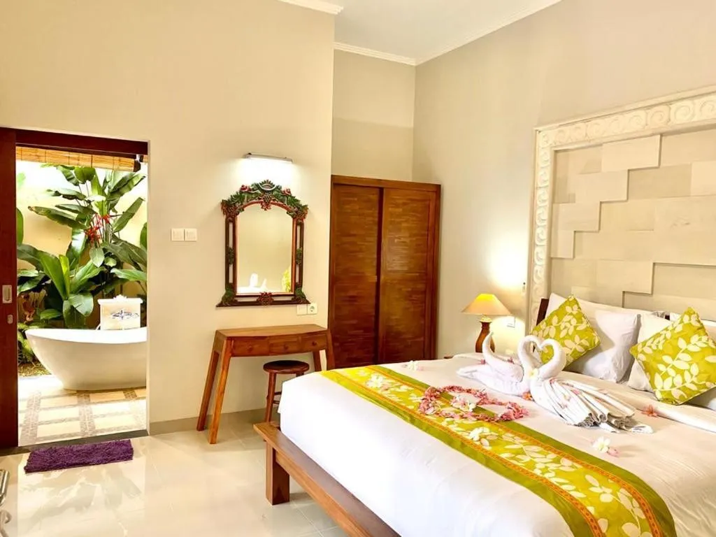 Bed in Three Brothers Bali Legian Bungalows & Villas