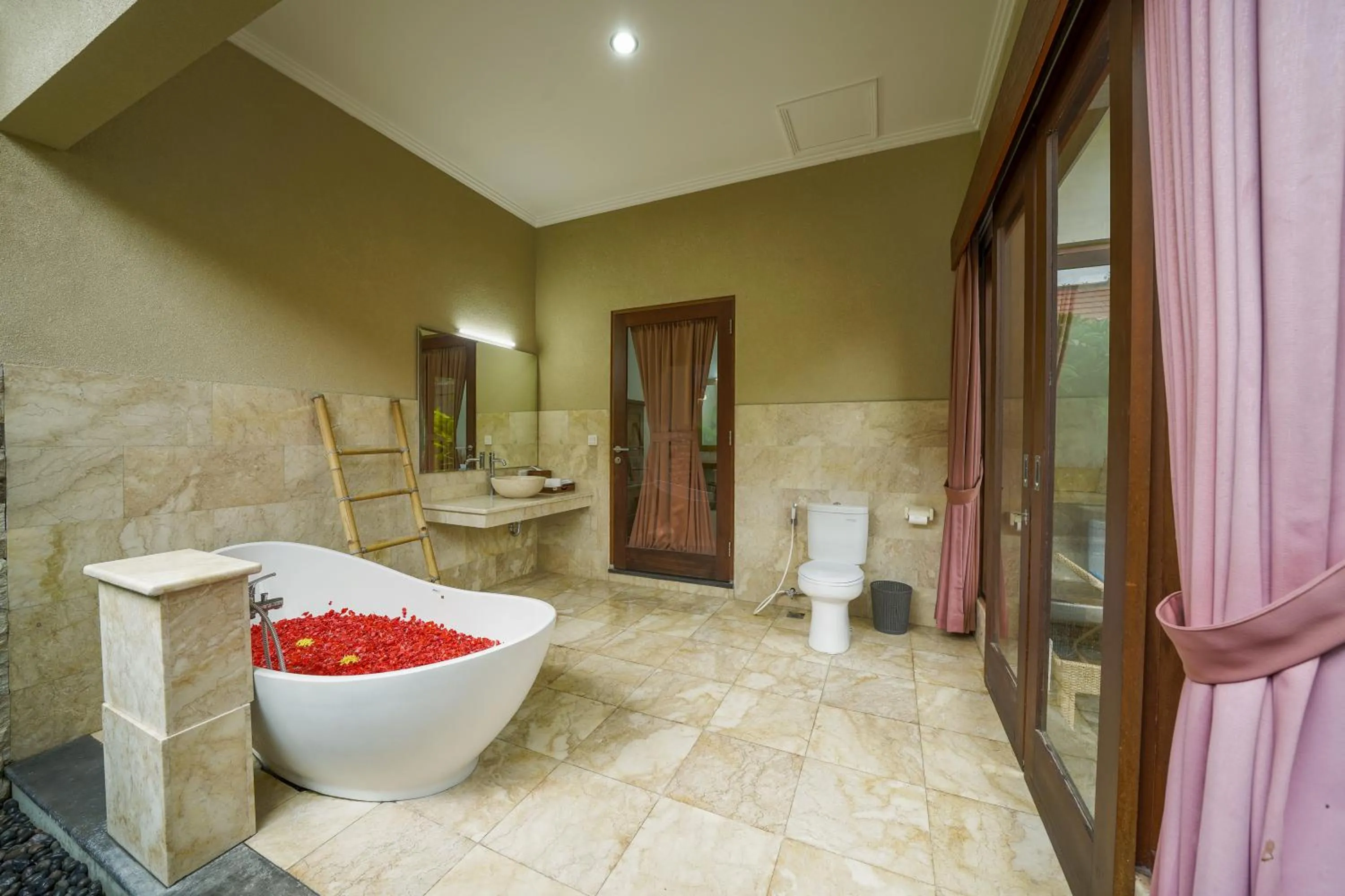 Toilet in Three Brothers Bali Legian Bungalows & Villas