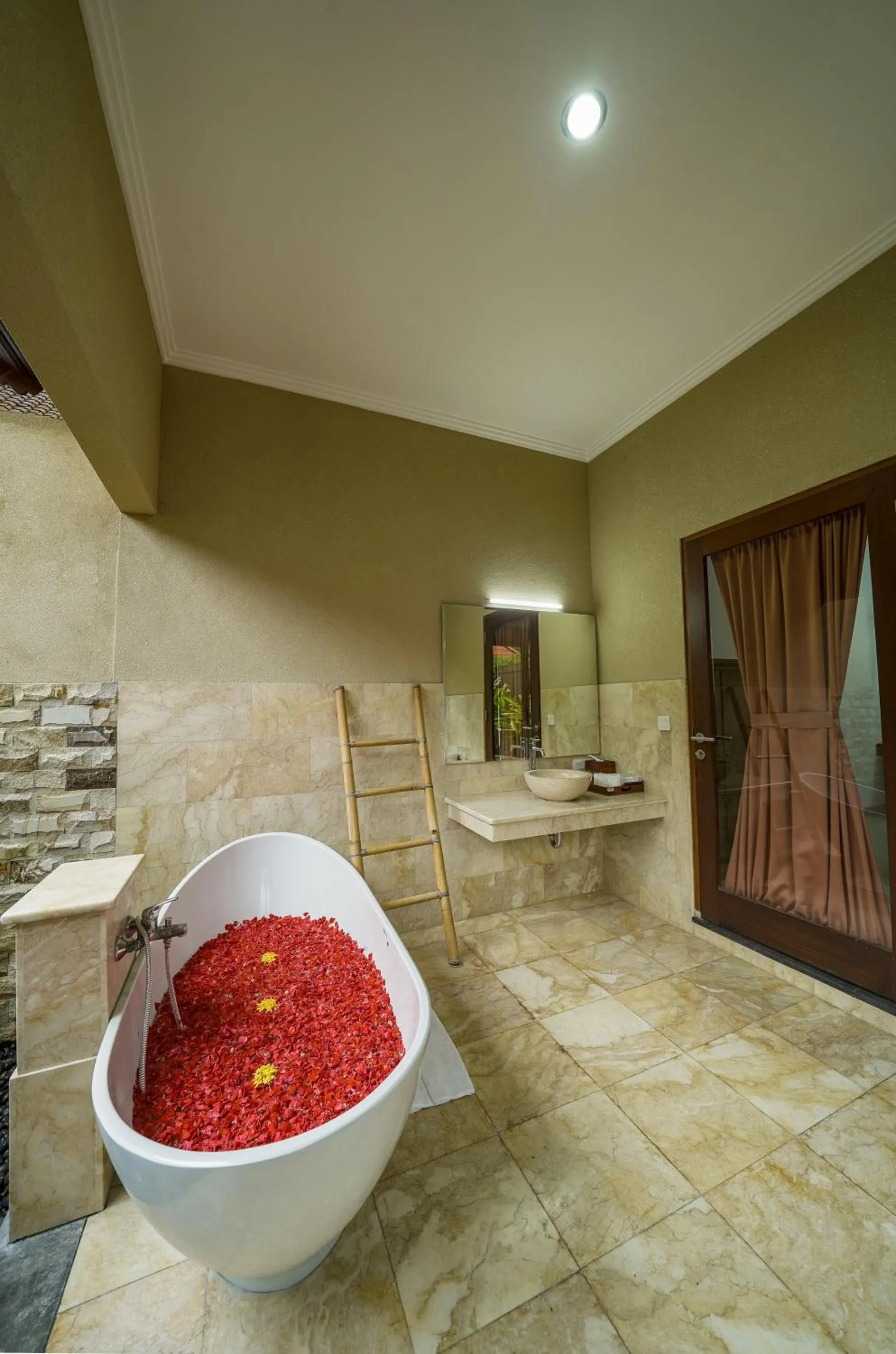 Bathroom in Three Brothers Bali Legian Bungalows & Villas