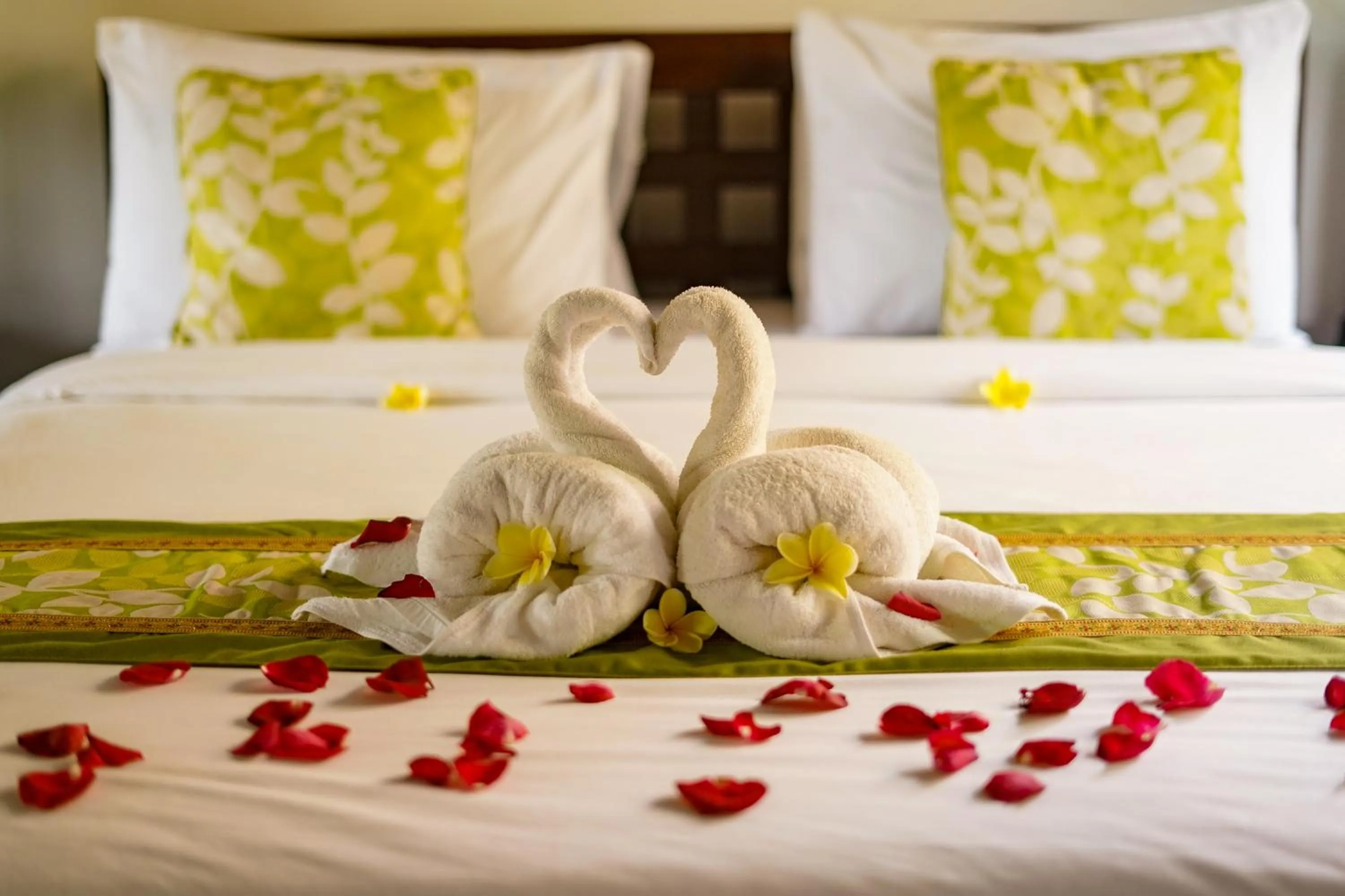 Bed in Three Brothers Bali Legian Bungalows & Villas